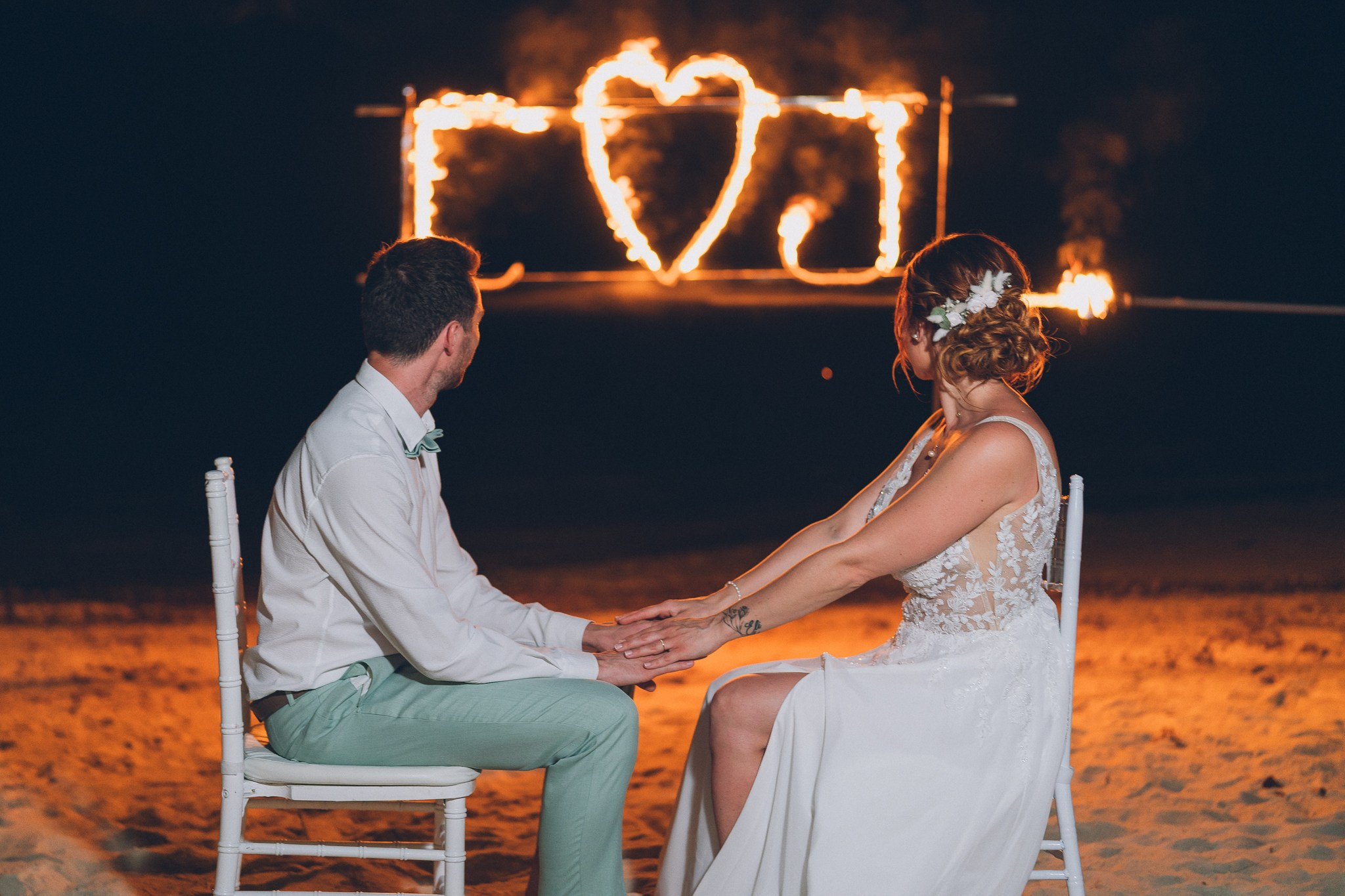Professional fire dancers performing at a luxury wedding in Thailand
