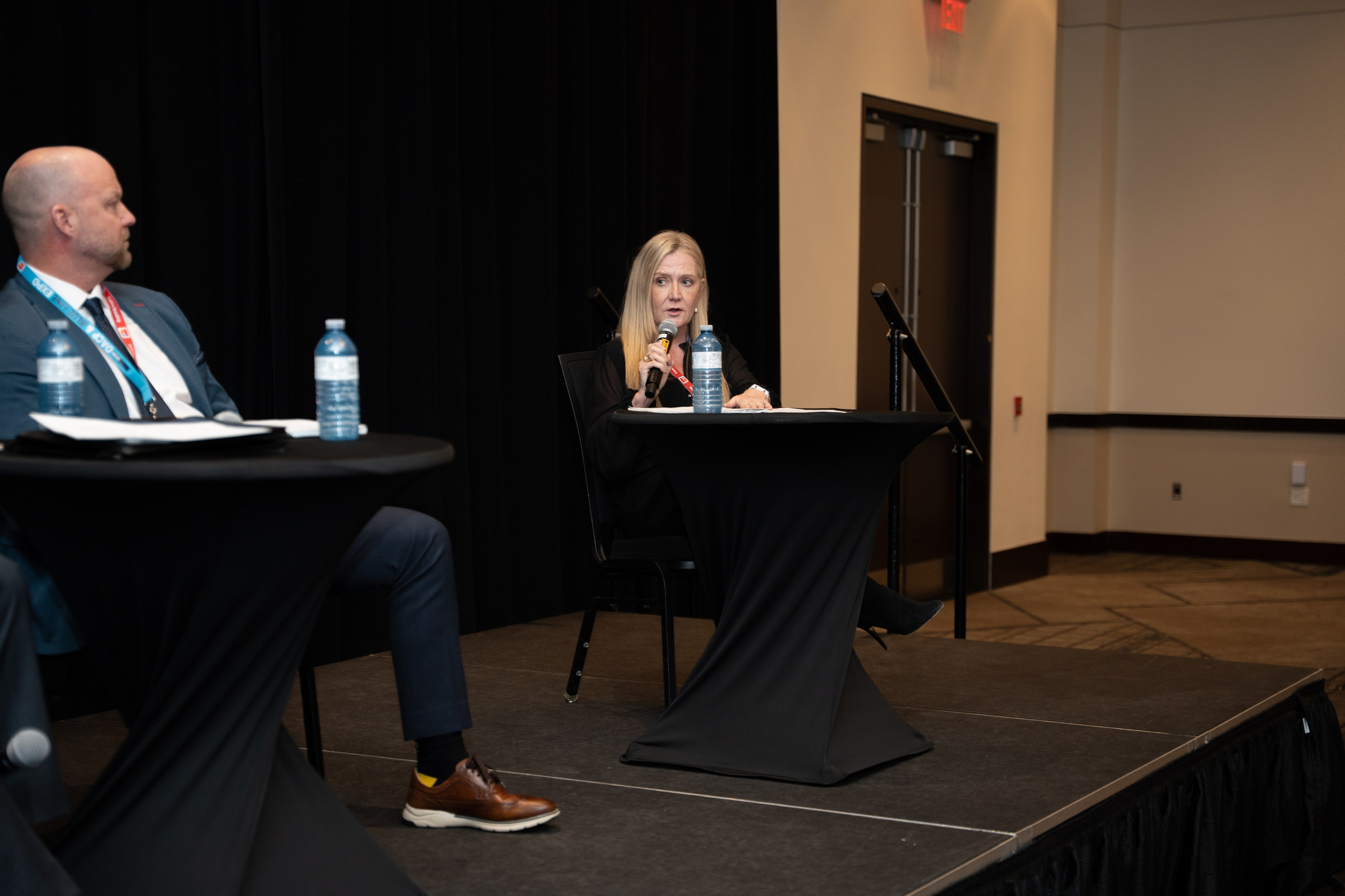 Speaker seated for panel or fireside chat, Blueline Expo 2026
