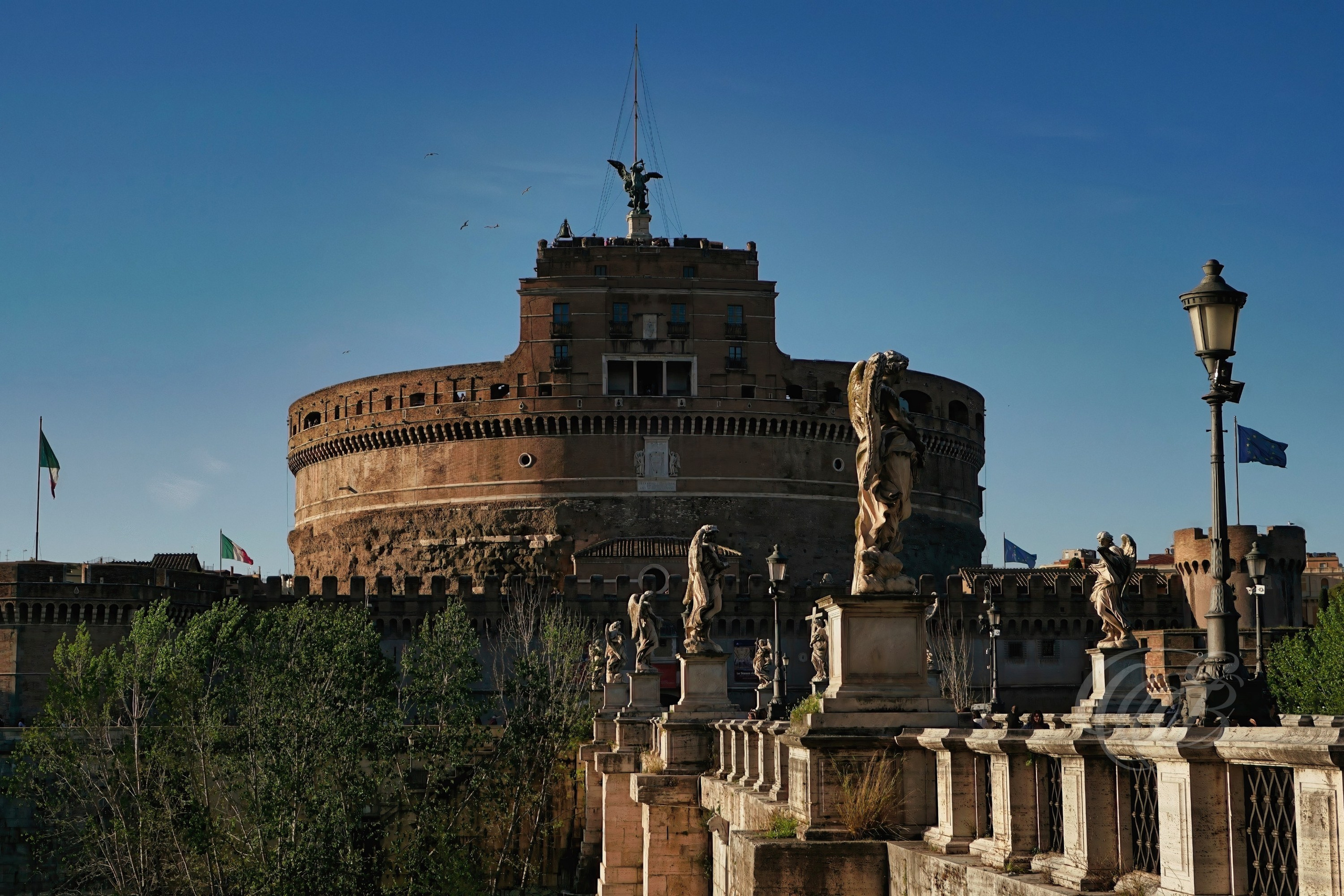 ITALY TRAVEL PHOTOGRAPHY – ITALY – ROME — Ponte Sant’Angelo and Castel Sant’Angelo — Historic bridge spanning the Tiber River leading to Castel Sant’Angelo, the former Mausoleum of Emperor Hadrian, Rome, Italy — Eduardo Bartoli Photography.