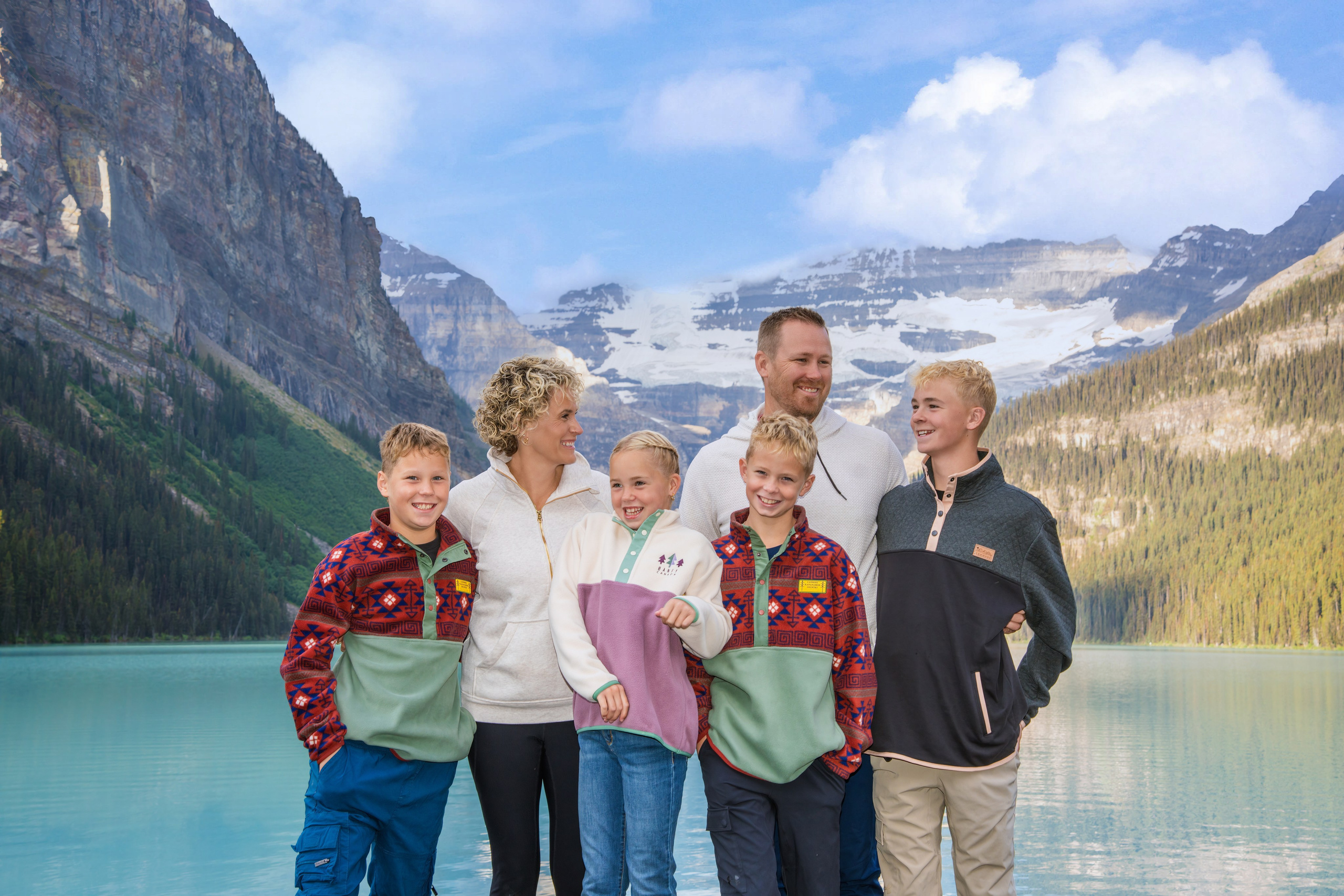 Family photo session in front of the Canadian Rockies at Lake Louise, Alberta