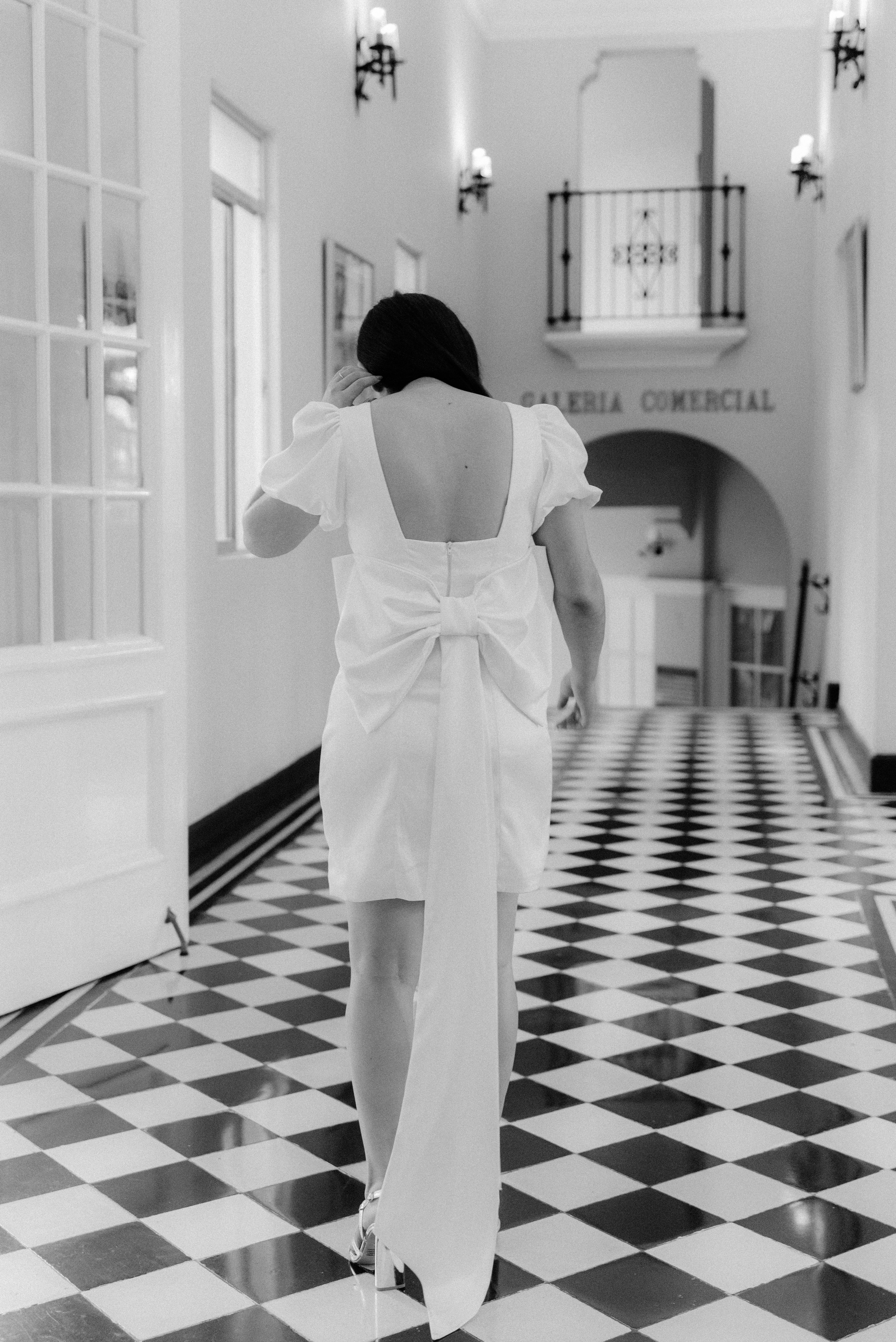 The bride is walking alone at Hotel El Prado