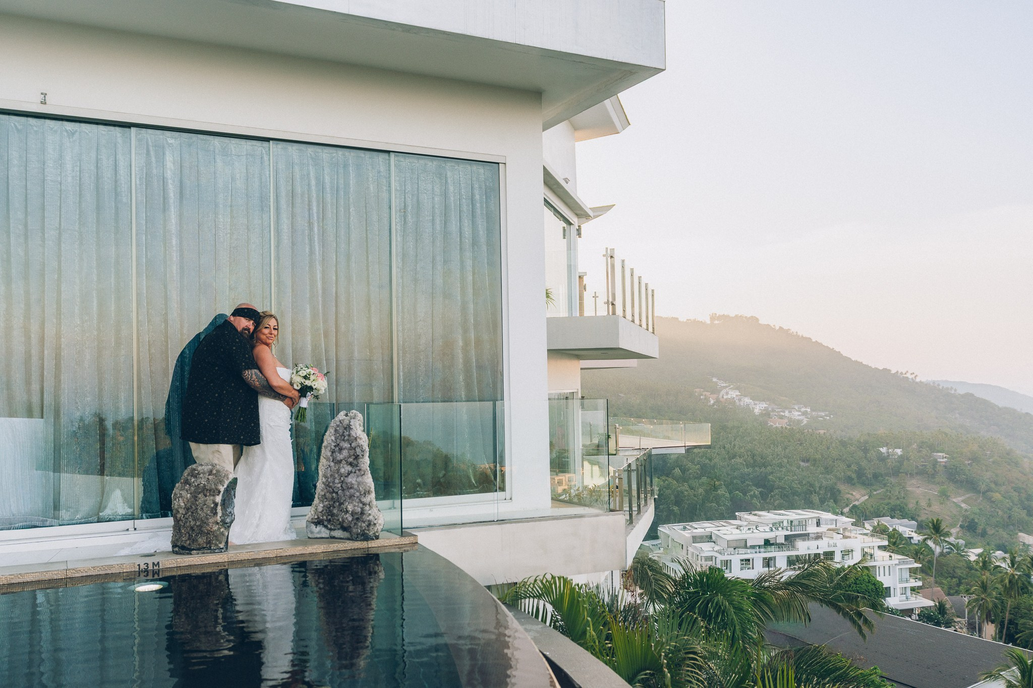 Bride and groom celebrating a sunset wedding at a villa in Koh Samui