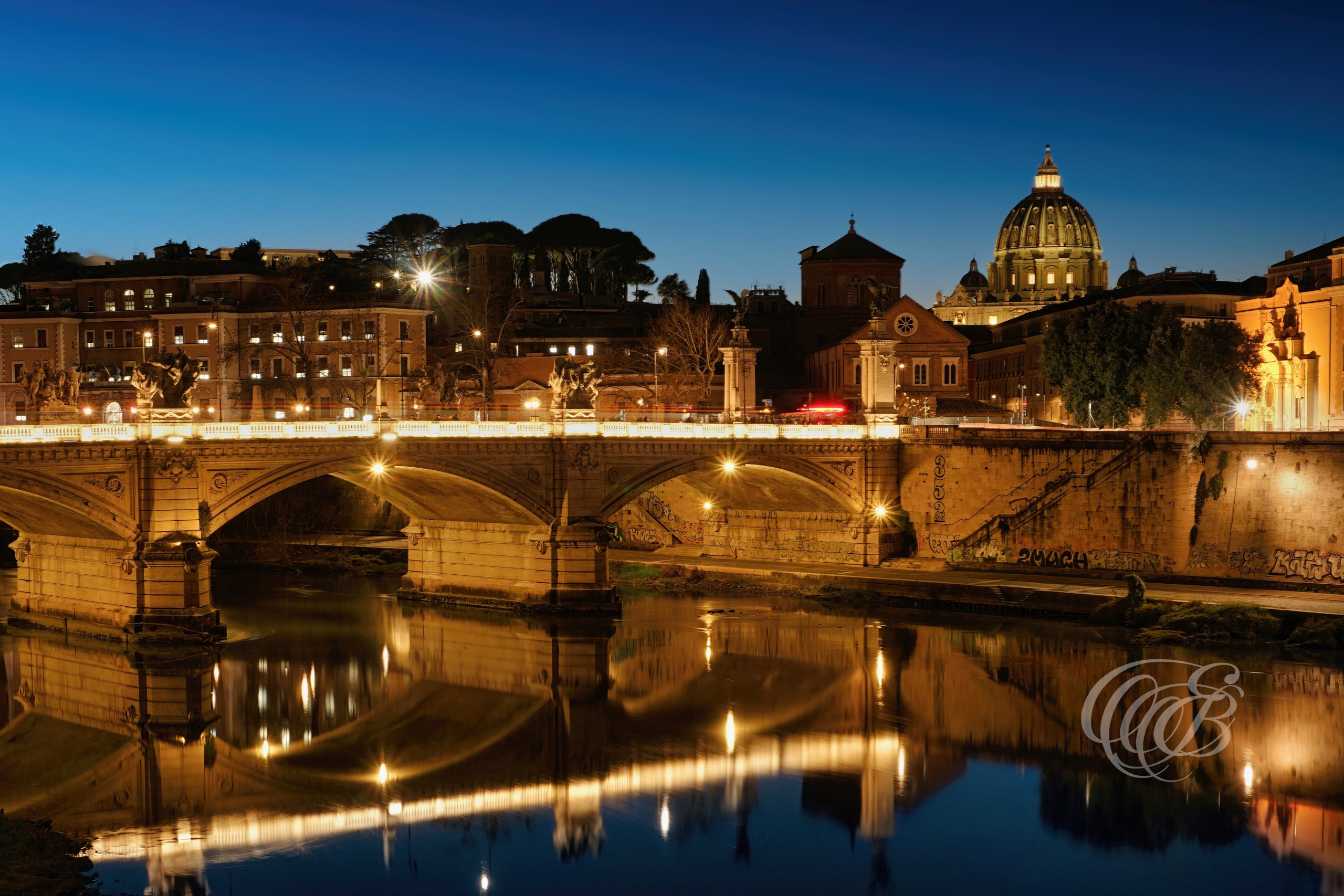 ITALY TRAVEL PHOTOGRAPHY – ITALY – ROME — Sunset at Ponte Vittorio Emanuele II — Historic bridge crossing the Tiber River connecting central Rome with the Vatican area, illuminated by evening light, Rome, Italy — Eduardo Bartoli Photography.