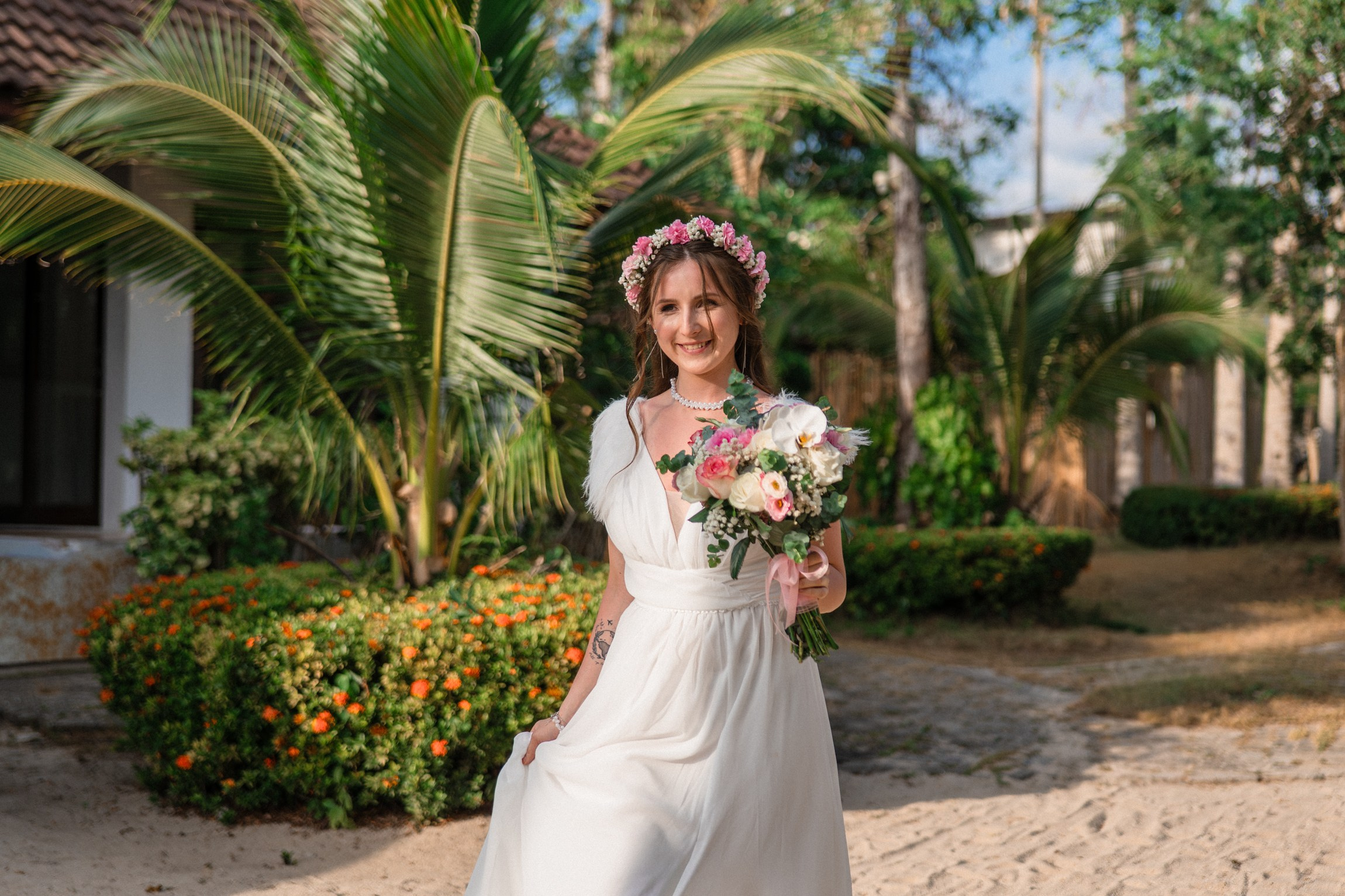 Bride and groom during a romantic beach wedding ceremony on Koh Samui, Thailand, surrounded by tropical scenery and ocean views
