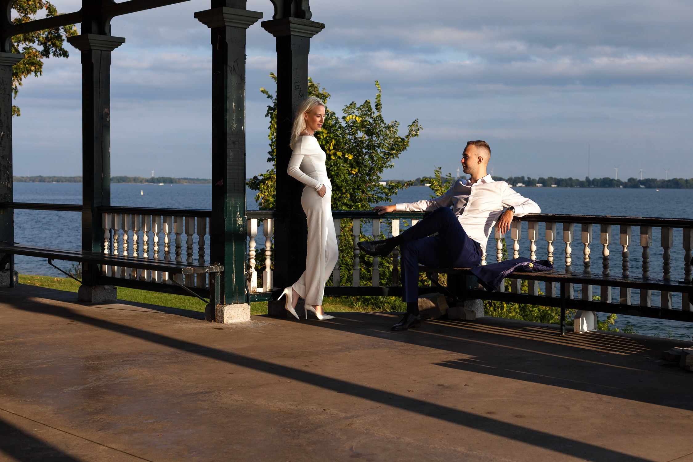 Couples lifestyle portrait near Newlands Pavilion at MacDonald Park Kingston, ON.