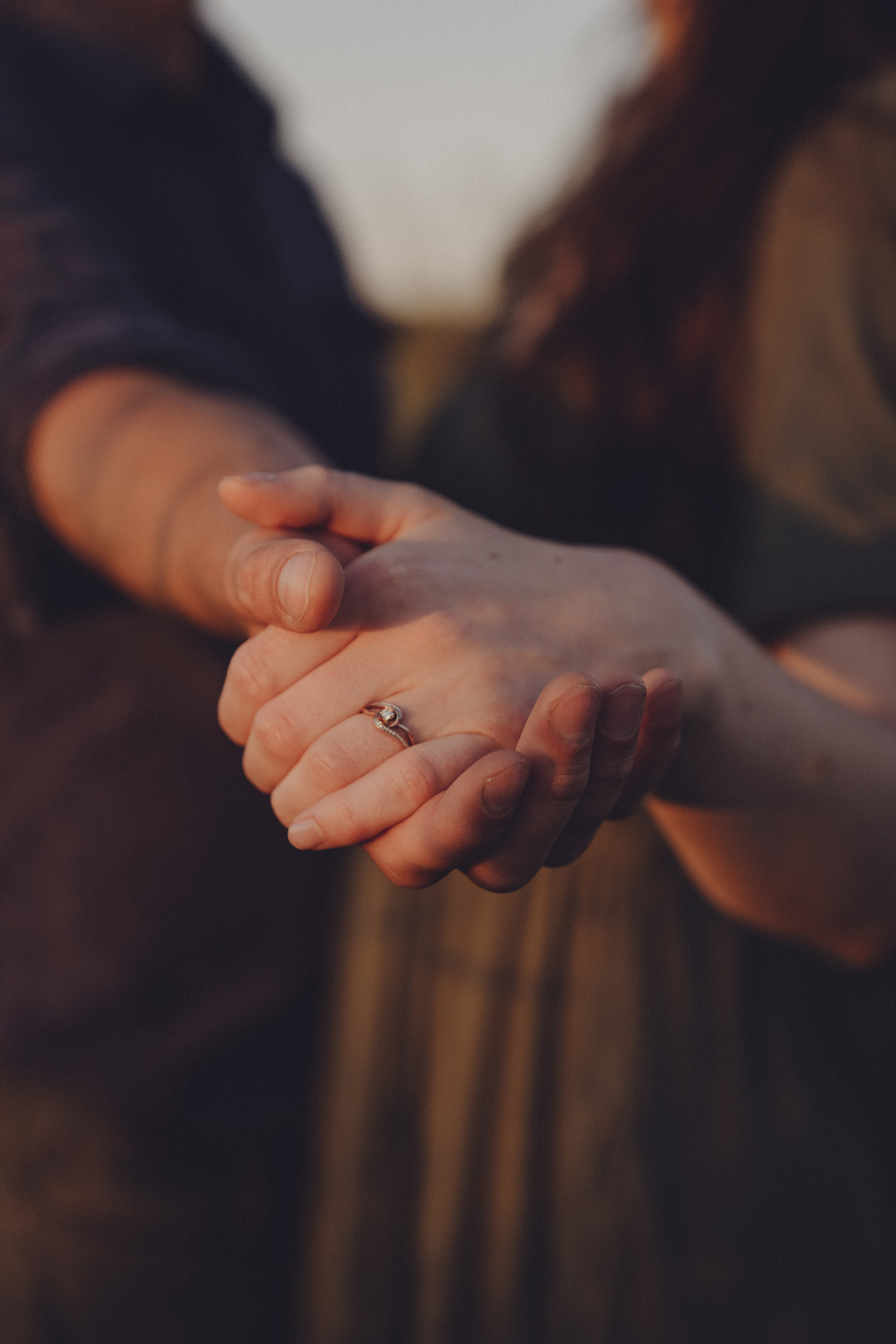 Holding hands with fingers gently touching
