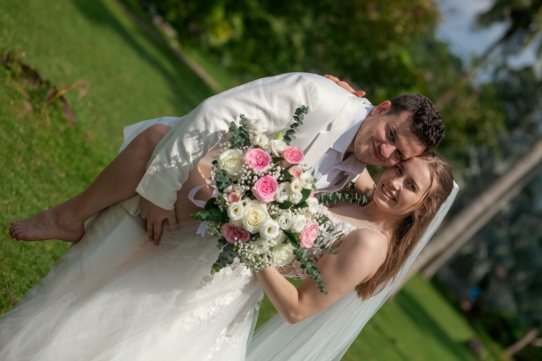 Couple celebrating a private destination wedding for two on a sandy beach in Koh Samui, Thailand