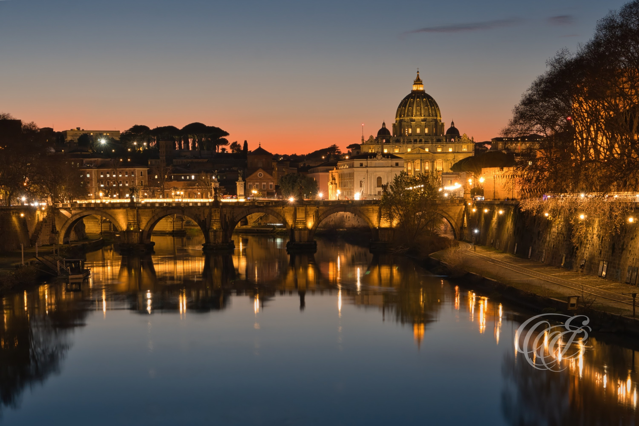 ITALY TRAVEL PHOTOGRAPHY – ITALY – ROME — Sunset over Ponte Sant’Angelo & St. Peter’s Basilica — Historic bridge over the Tiber River leading toward St. Peter’s Basilica in Vatican City, featuring Baroque angel sculptures and sunset light, Rome, Italy — Eduardo Bartoli Photography.