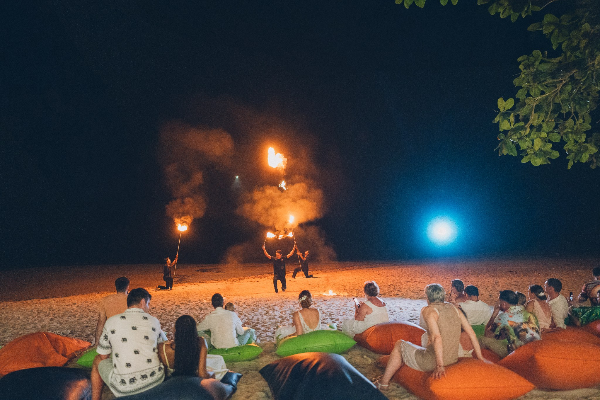 Spectacular fire show performance during a beach wedding reception in Koh Samui