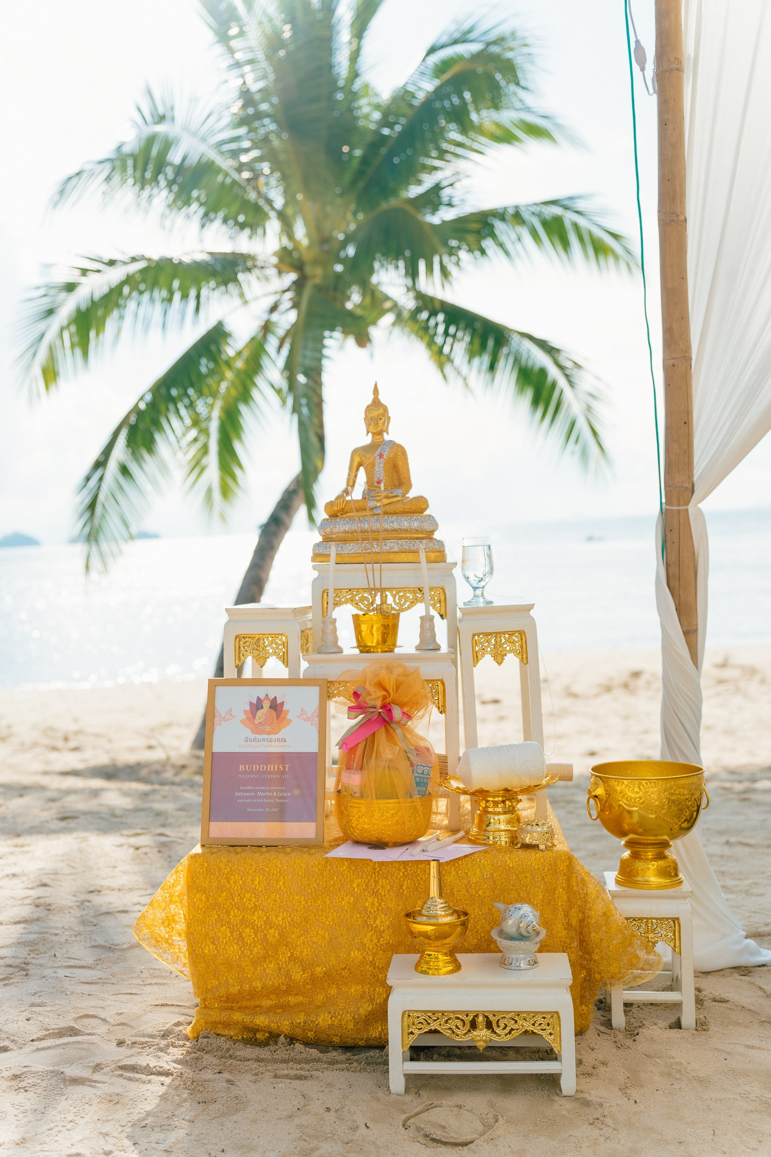 Couple celebrating a spiritual Buddhist wedding ceremony on Koh Samui