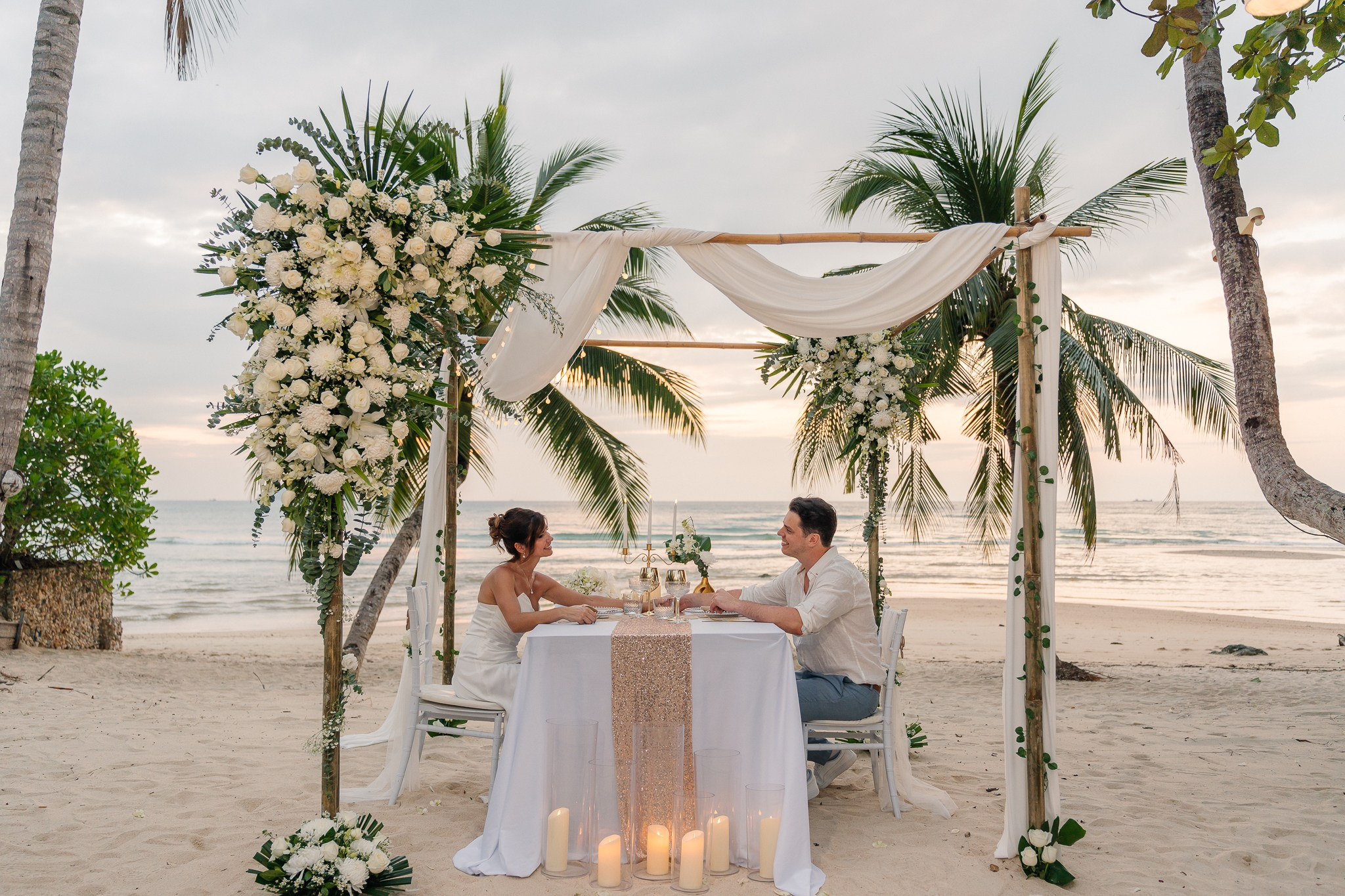 Romantic just for 2 beach wedding in Koh Samui, Thailand, featuring an intimate elopement ceremony with tropical ocean views and floral decor.