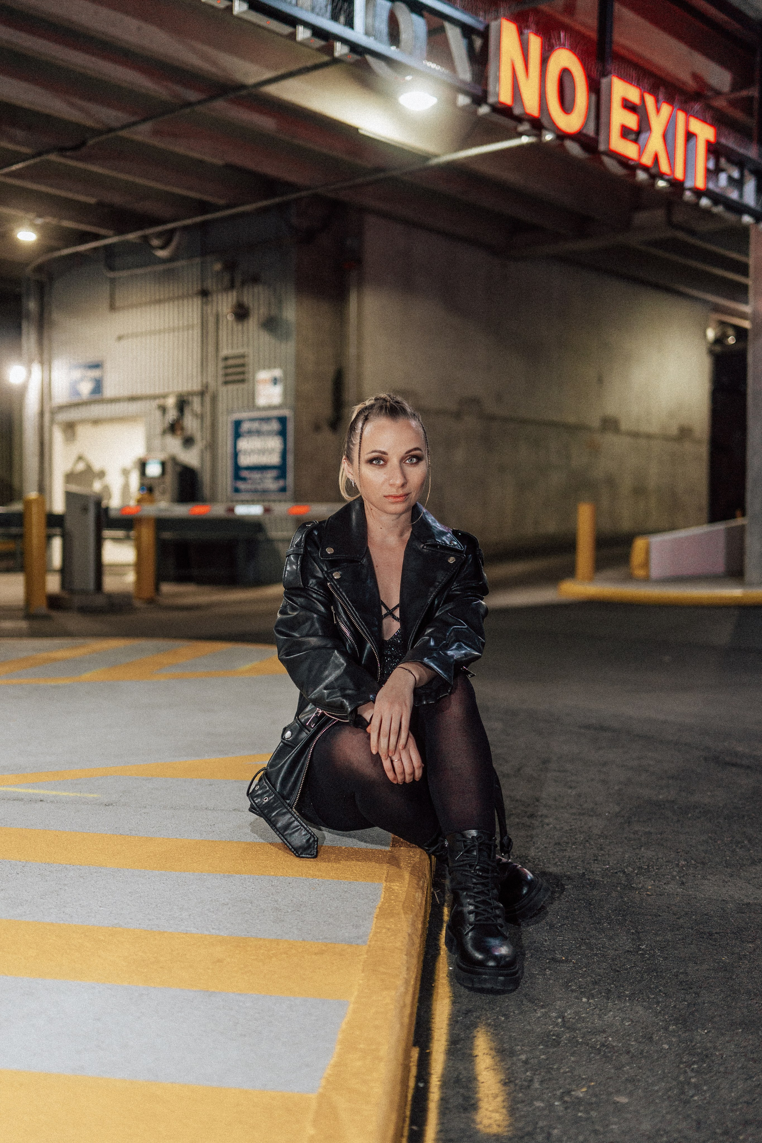 Individual portrait session in a Windsor parking lot, blending creative photography with urban aesthetics.