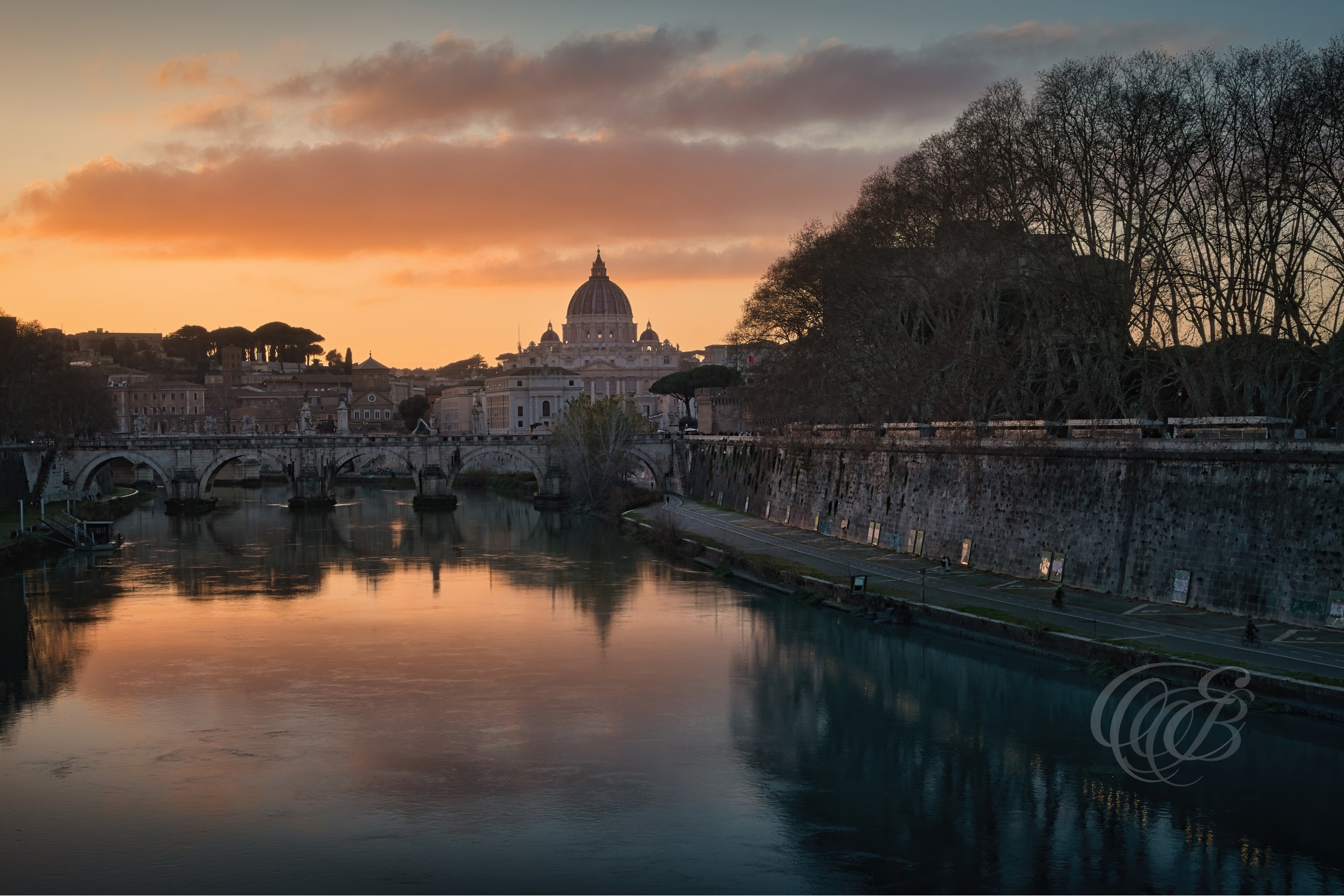 ITALY PHOTOGRAPHY — Ponte Sant'Angelo and the Vatican Dome — Ponte Sant'Angelo spanning the Tiber River with the dome of St. Peter's Basilica rising beyond, linking two of Rome's most iconic landmarks, Rome, Italy — Eduardo Bartoli Photography.