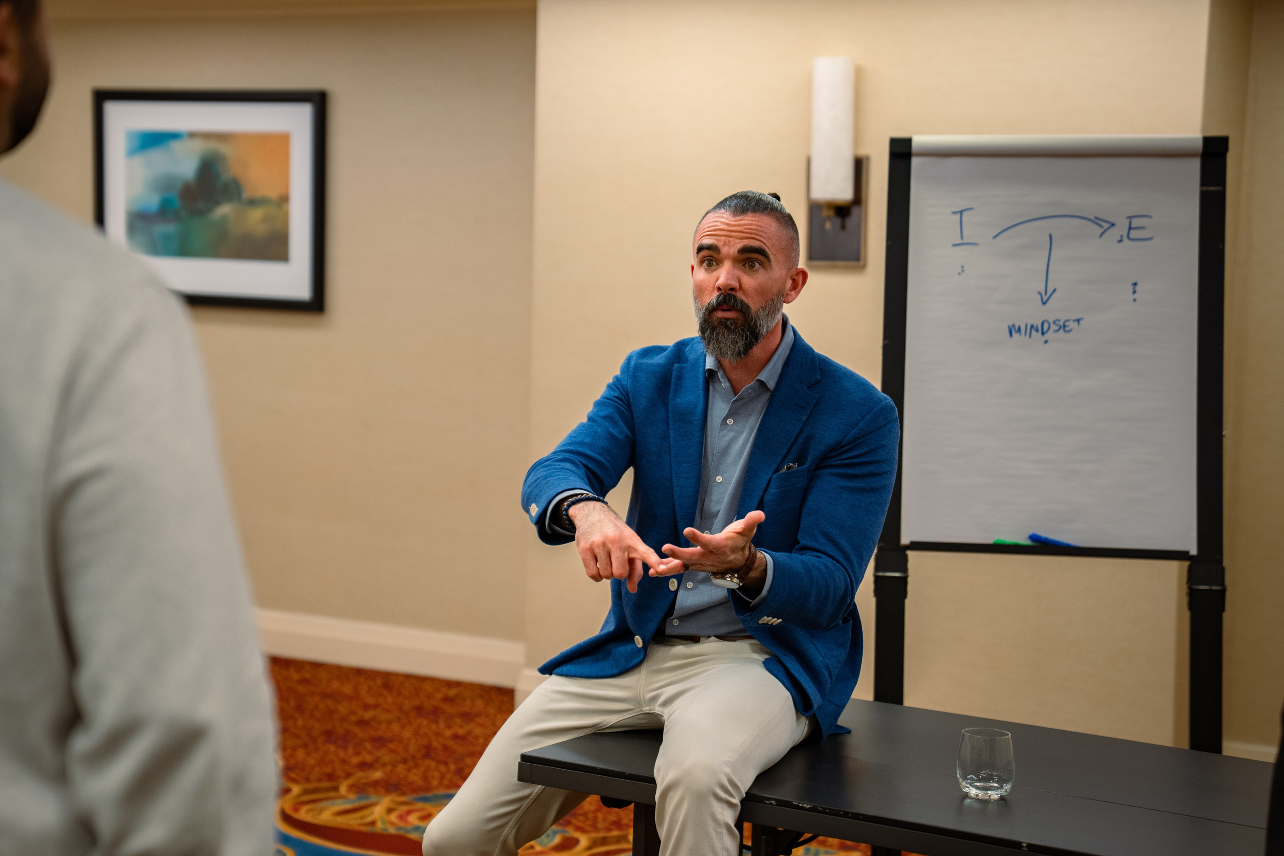 Matt Poechman in conversation with attendee at networking event