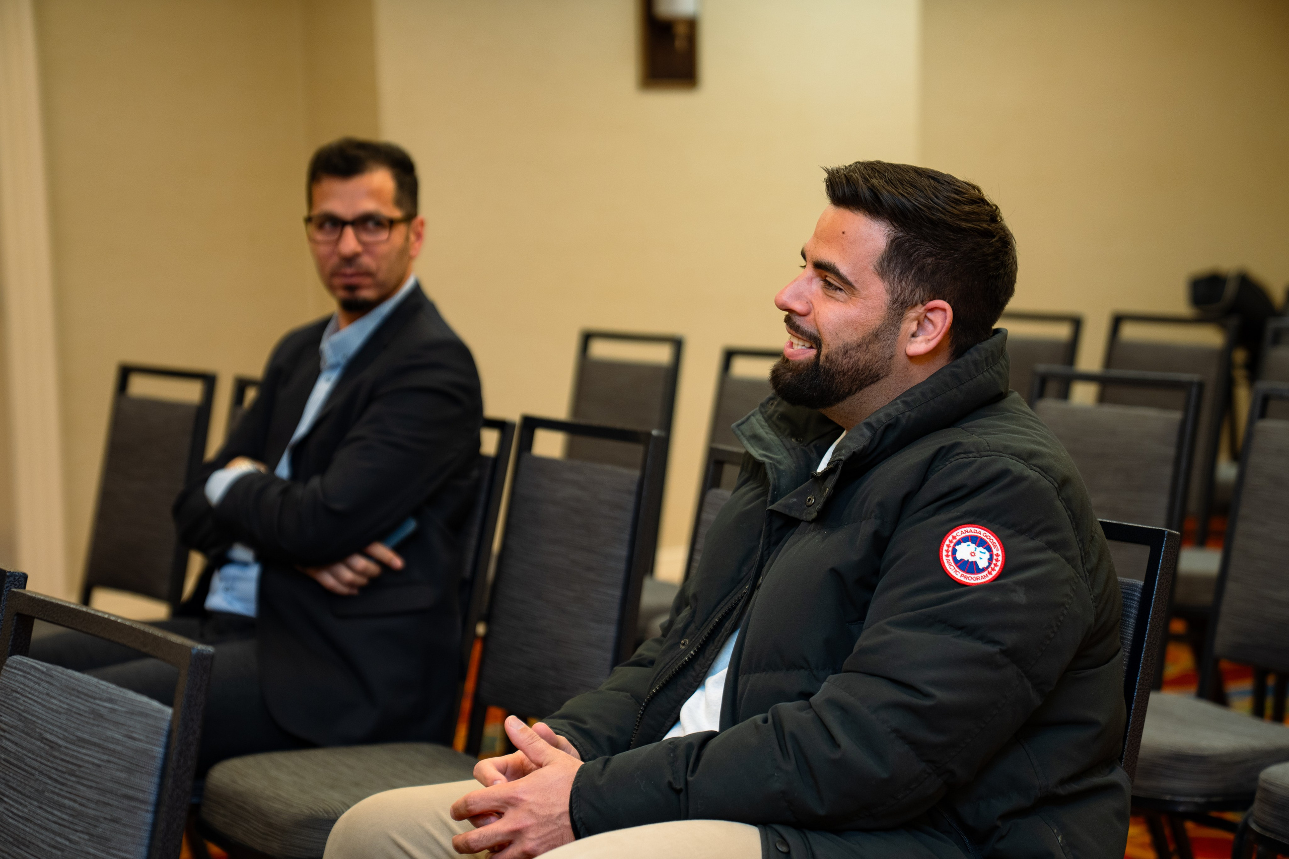 Two attendees in conversation at real estate networking event