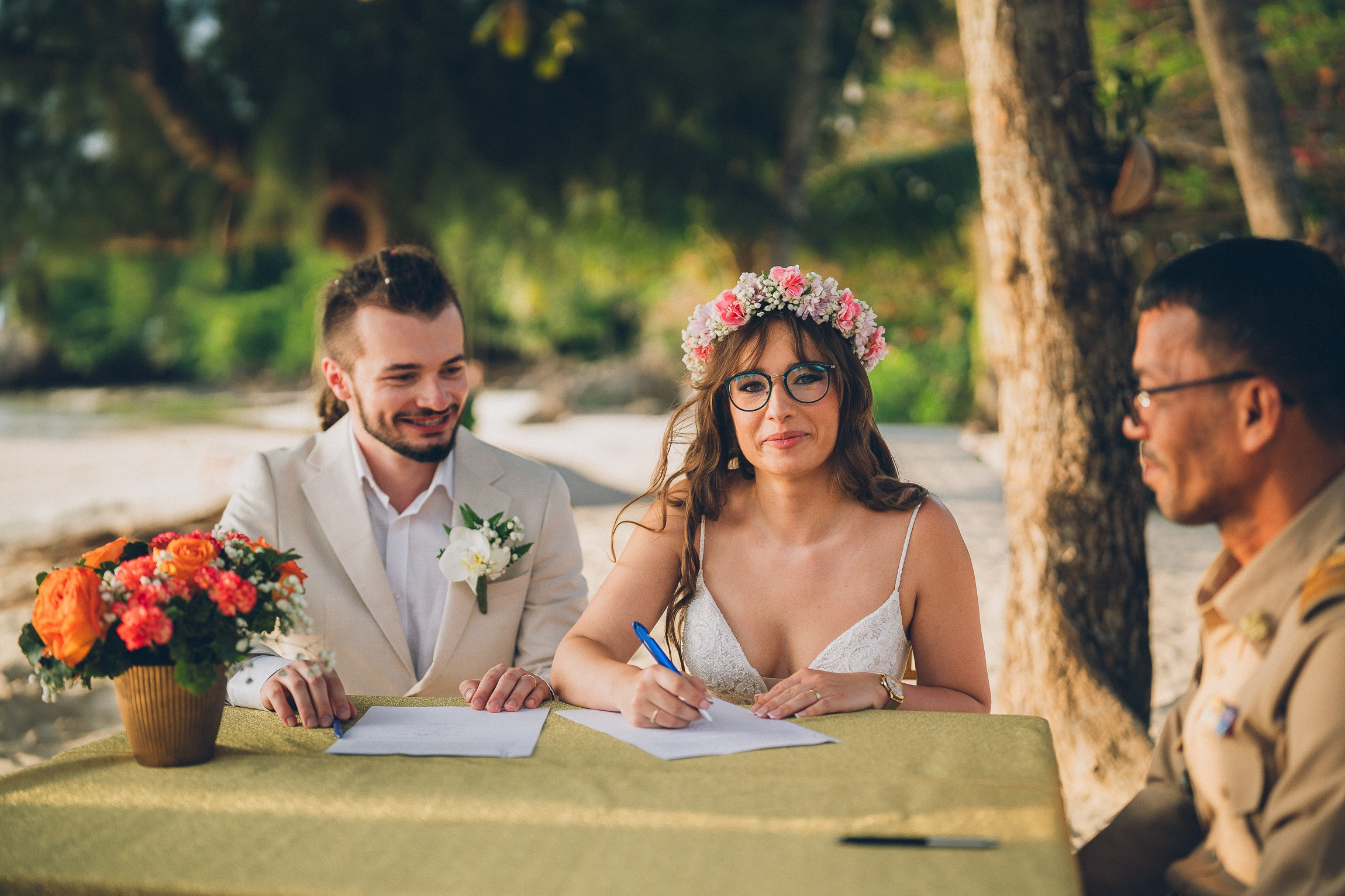 Bride and groom enjoying a just for 2 beach wedding in Koh Samui, Thailand, surrounded by tropical scenery and ocean views