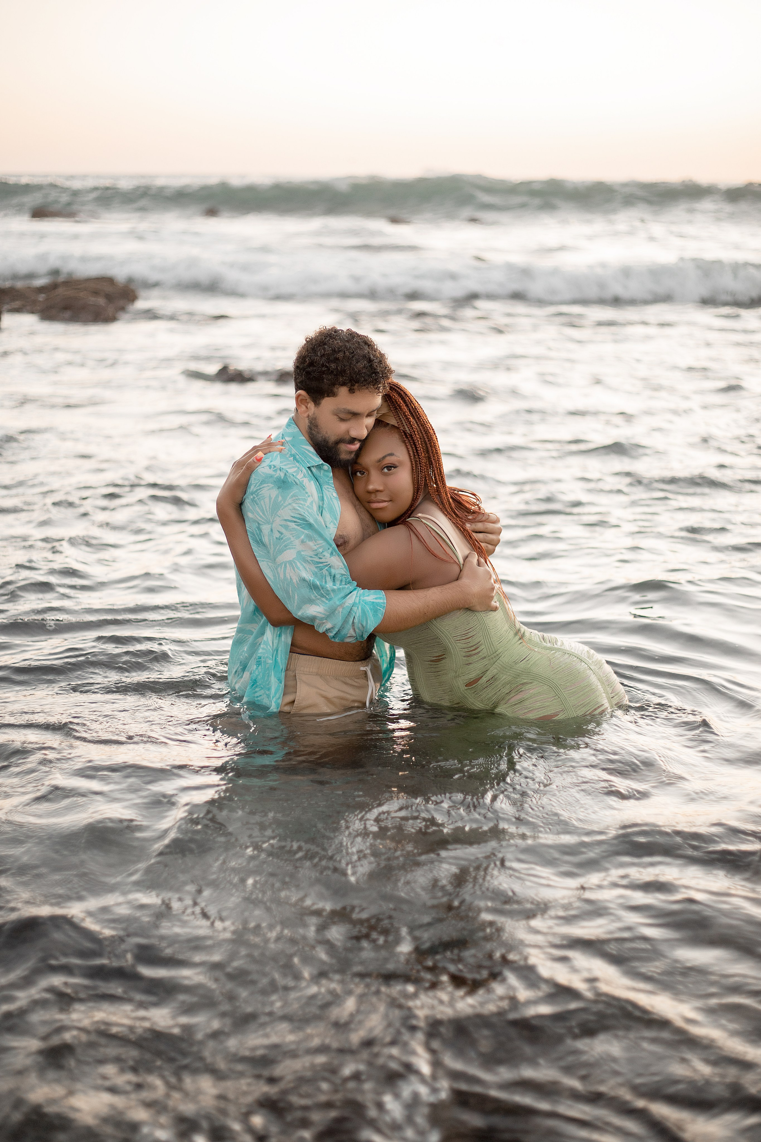 Maternity photoshoot at the ocean with sunset 
