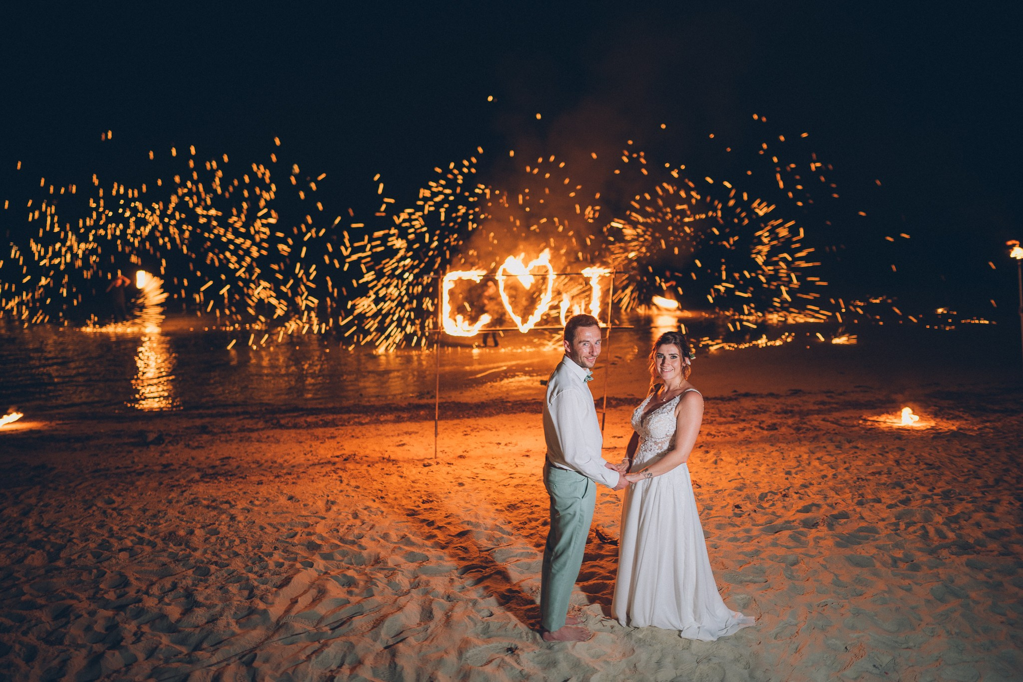Professional fire dancers performing at a luxury wedding in Thailand