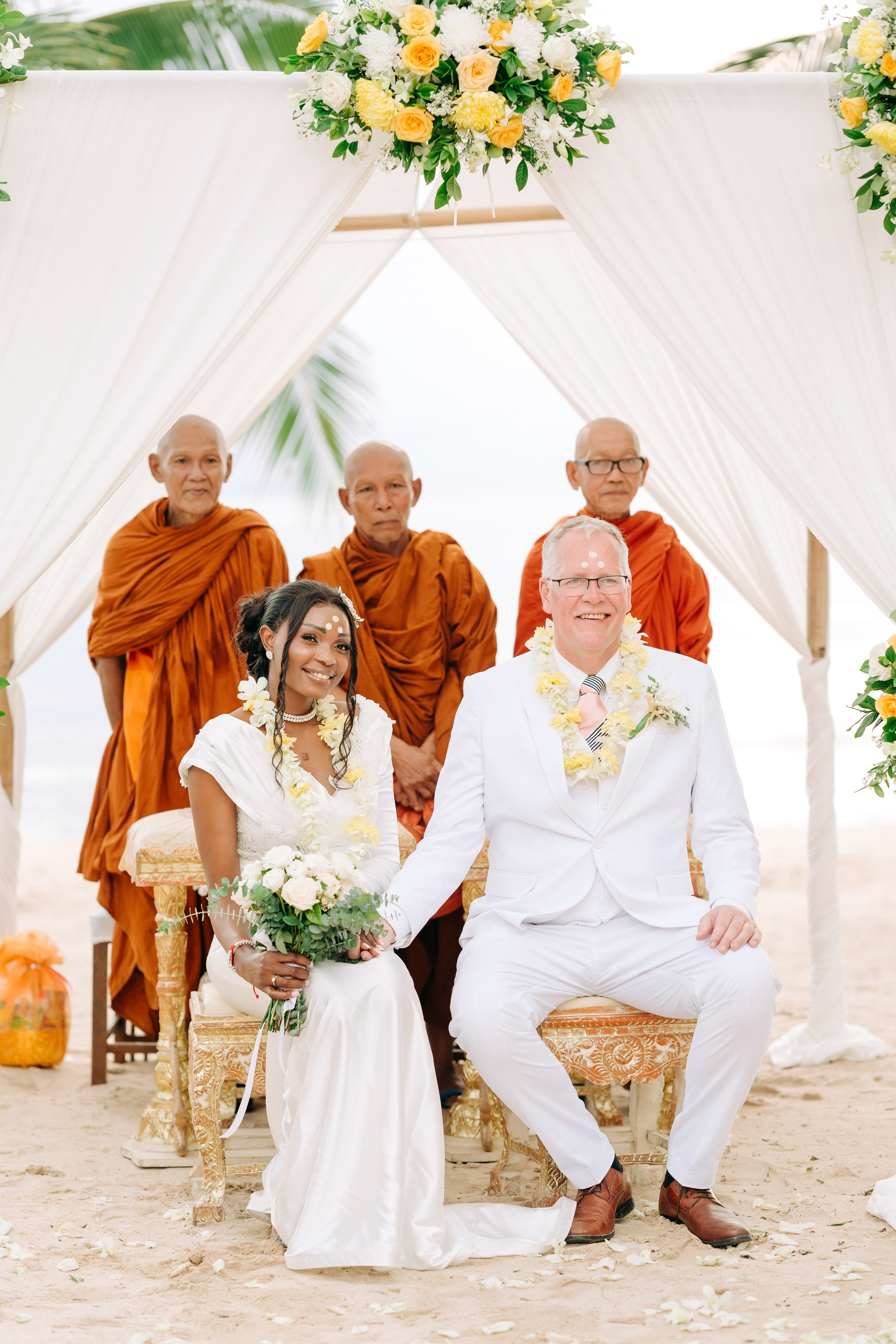 Romantic Buddhist wedding ceremony with guests in Koh Samui, Thailand