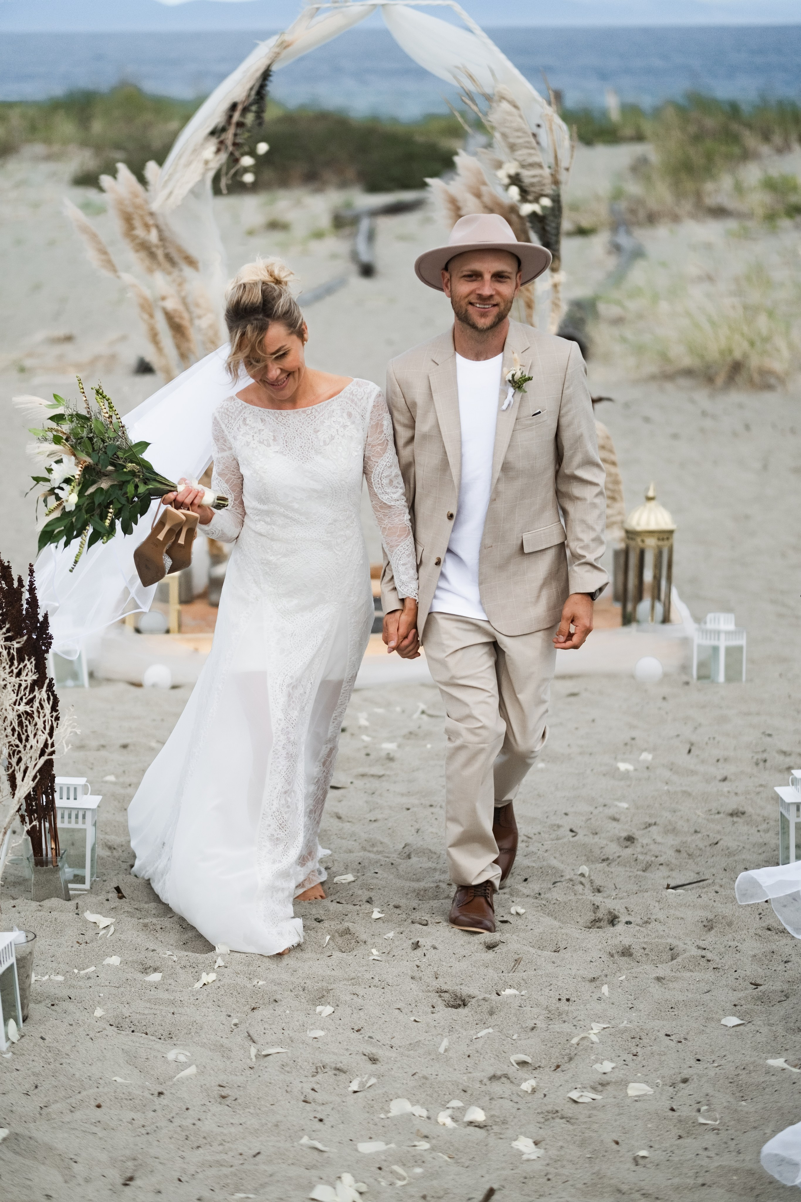 couple holding hands during vows