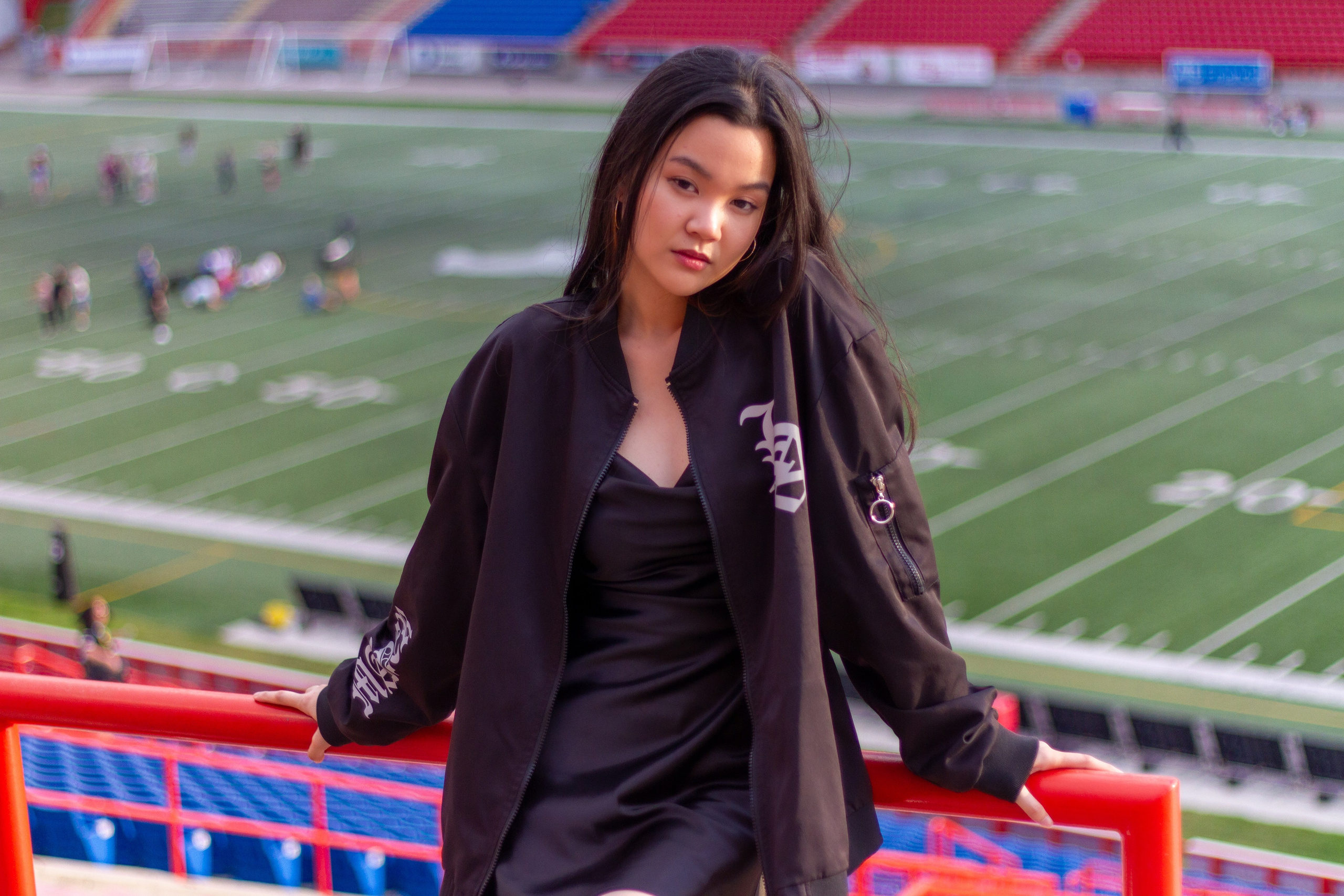 Model Ann at McMahon Stadium: A Stunning Photoshoot Under the Stadium Lights. ProFly Media Inc. — Cinematic photo and video production for brands, businesses, and spaces in Calgary