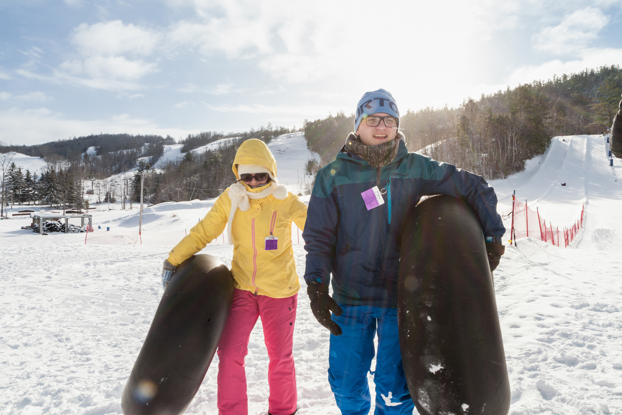 Winter family lifestyle photography with snow tubing, snow portrait in Ontario.