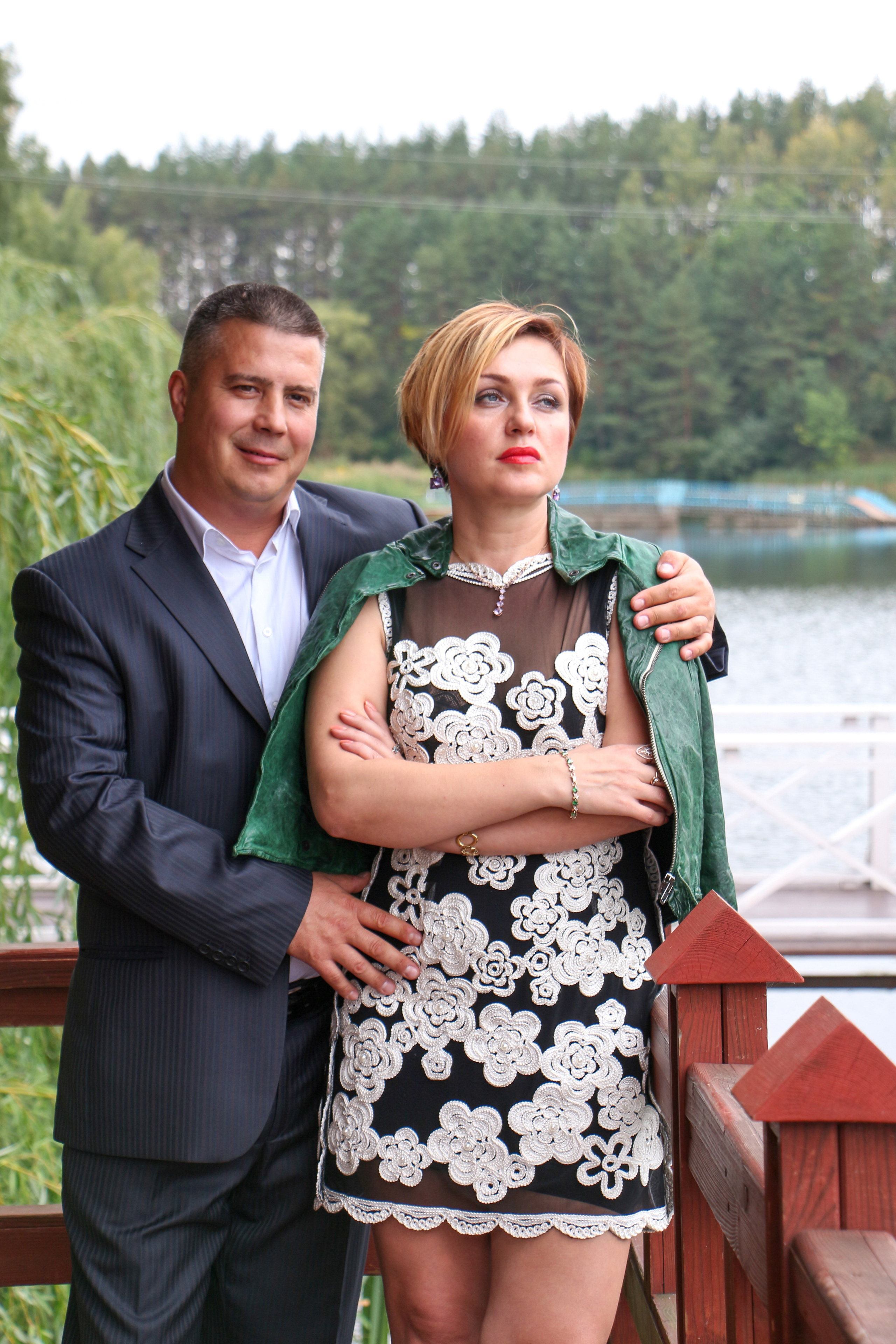 Candid couple lifestyle portrait near a lake, storytelling engagement photography.