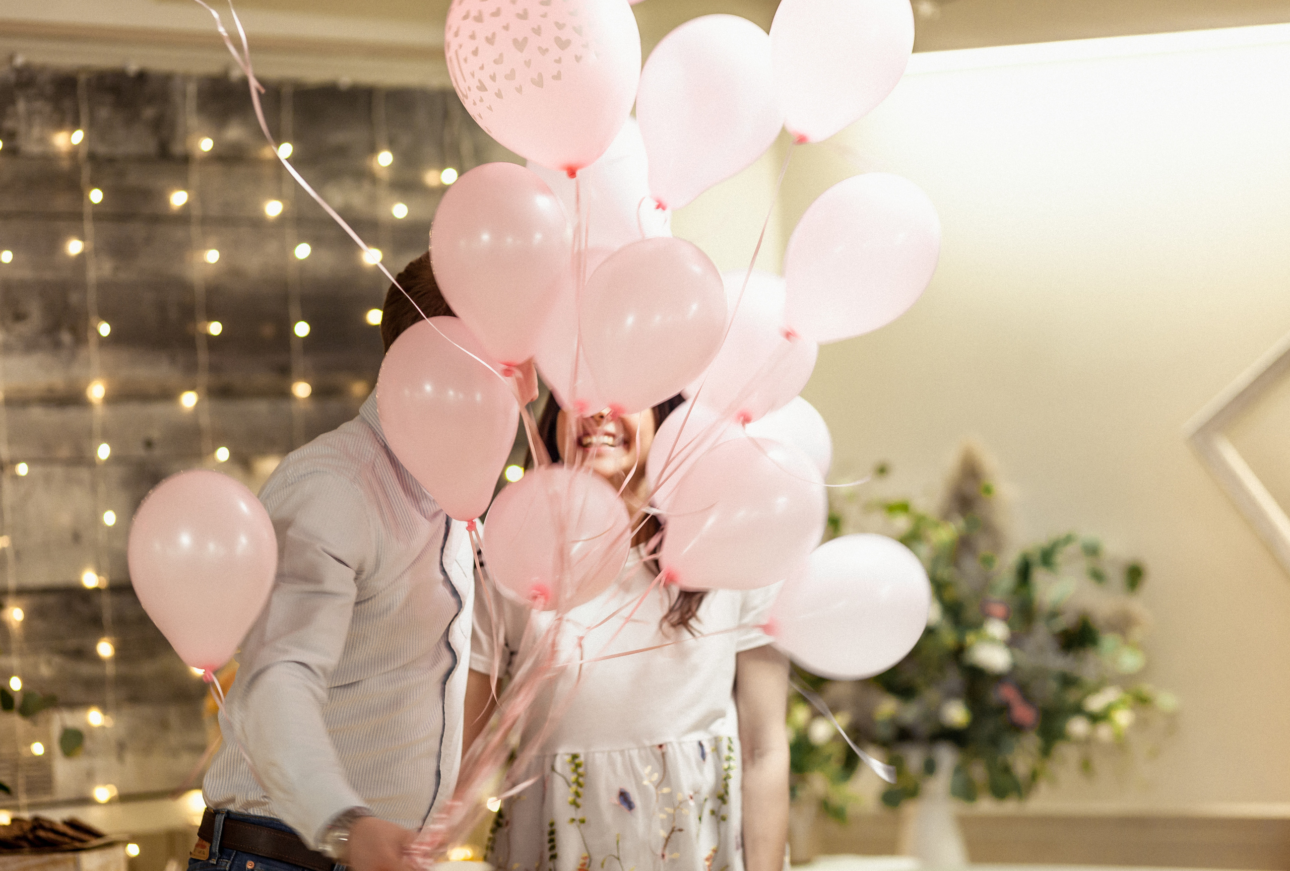 Maternity gender reveal photo session with pink balloons near Dow's Lake, Ottawa.