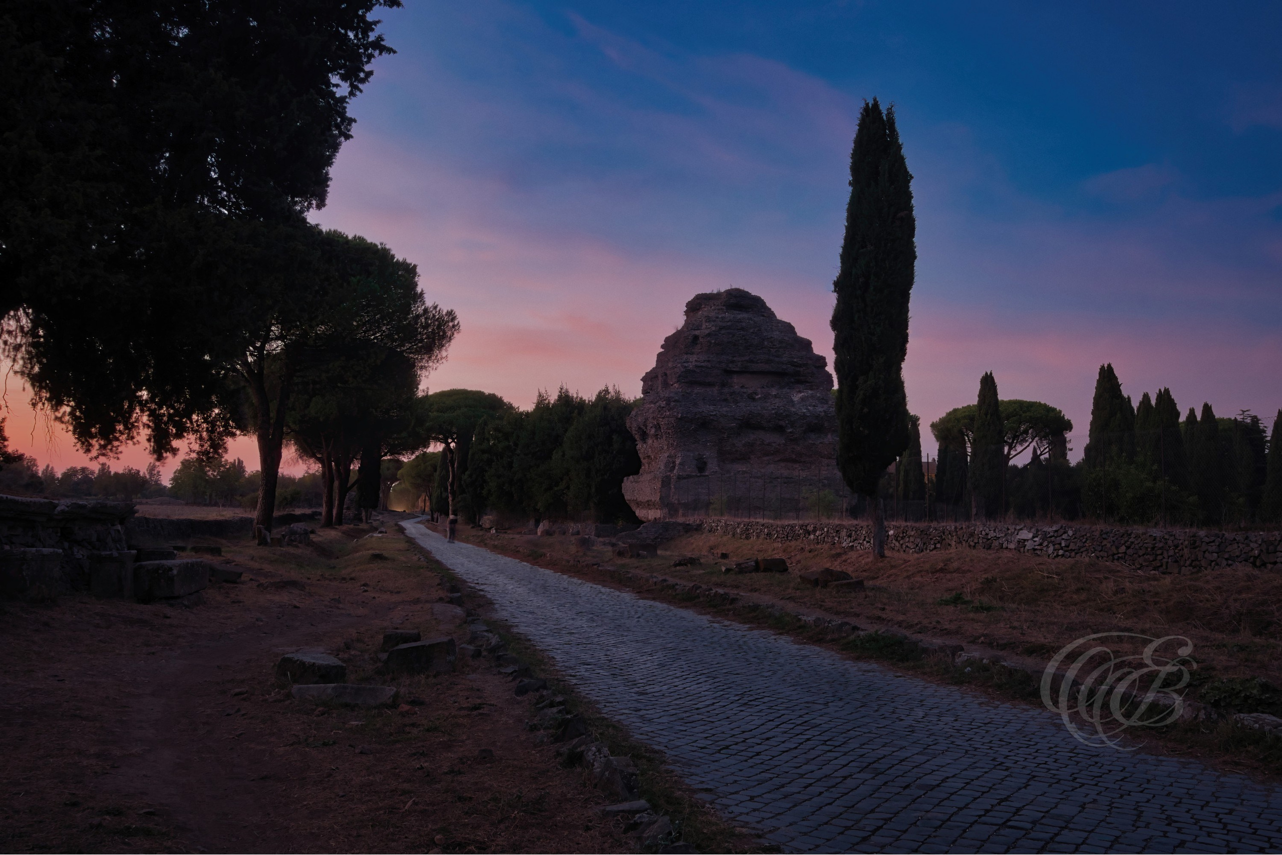 ITALY PHOTOGRAPHY — The Appian Way at Dusk — The Appian Way, one of the oldest and most influential roads of the Roman Republic, preserving centuries of history beyond the ancient walls of Rome, Italy — Eduardo Bartoli Photography.