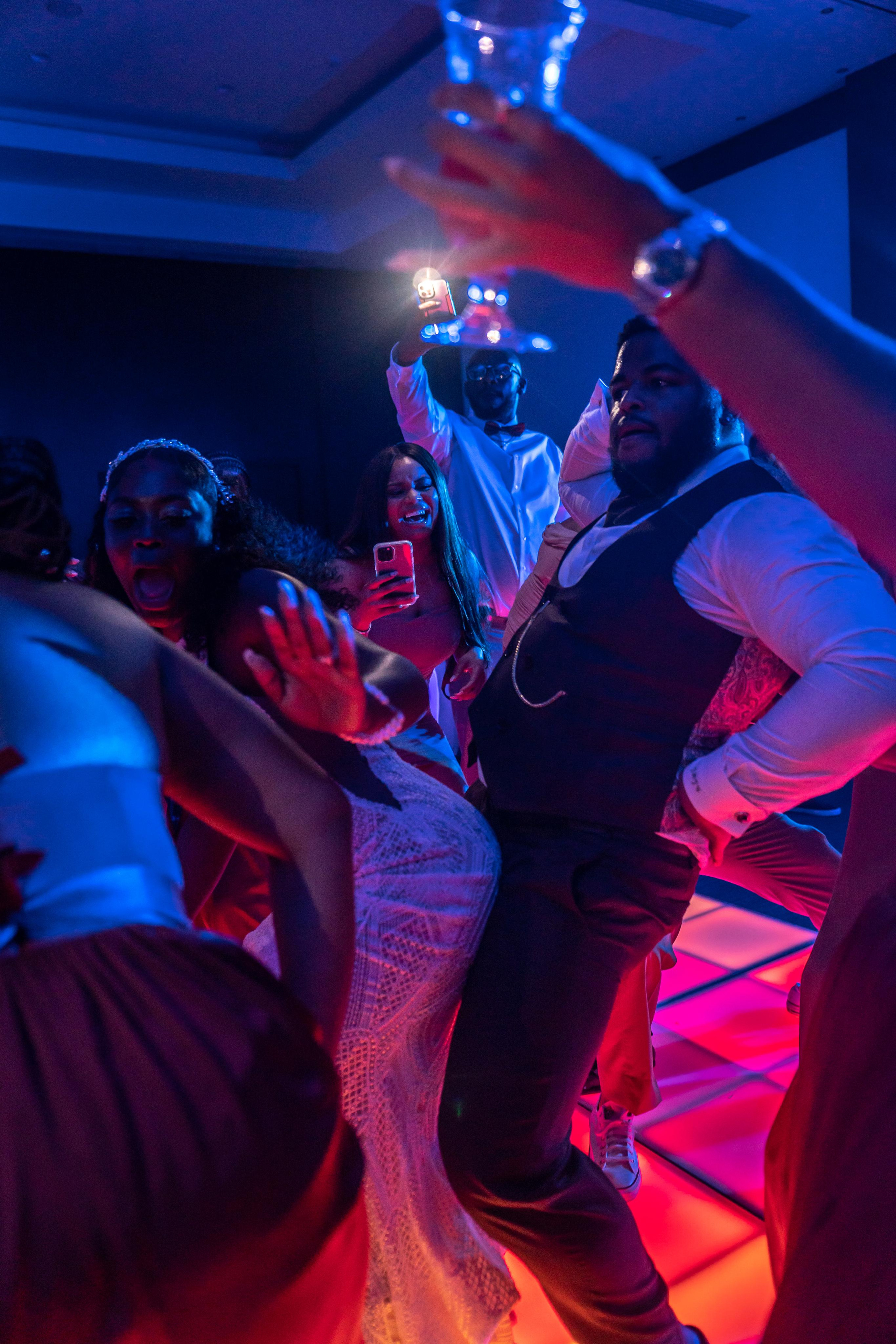 Wedding reception fun – colorful lights and dancing in Playa Mujeres