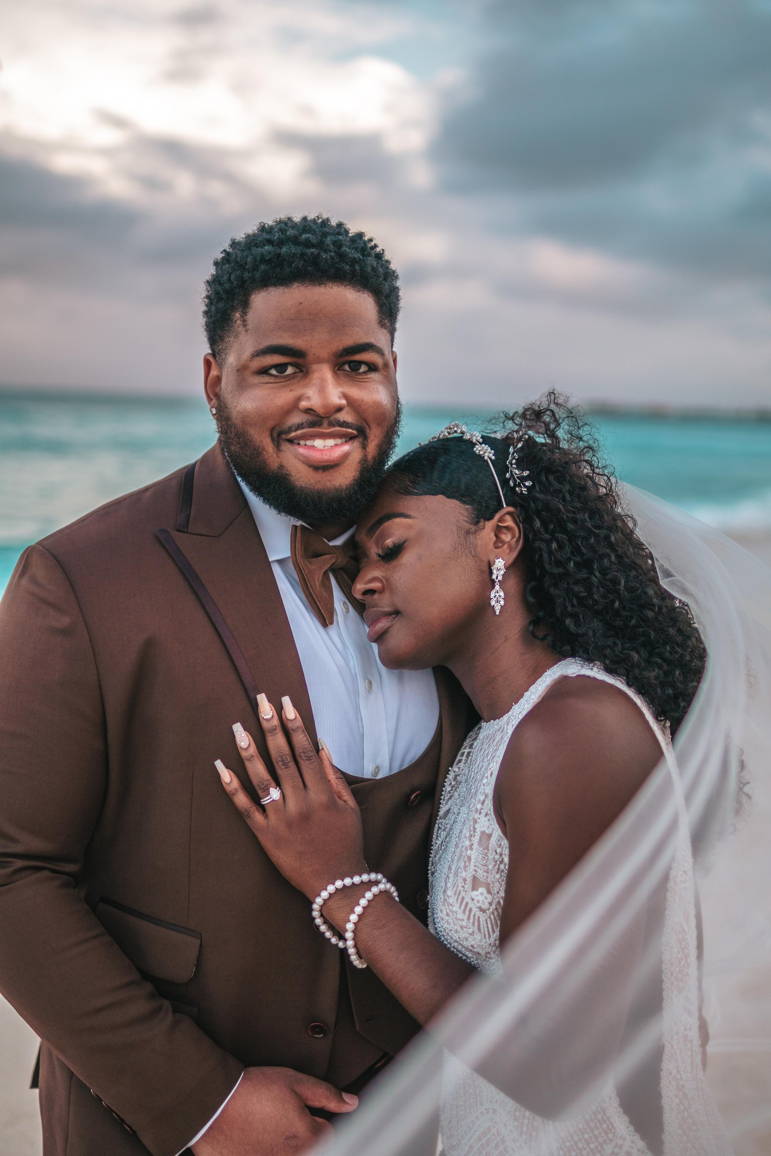 Couple embracing bad weather on their wedding day – authentic moments