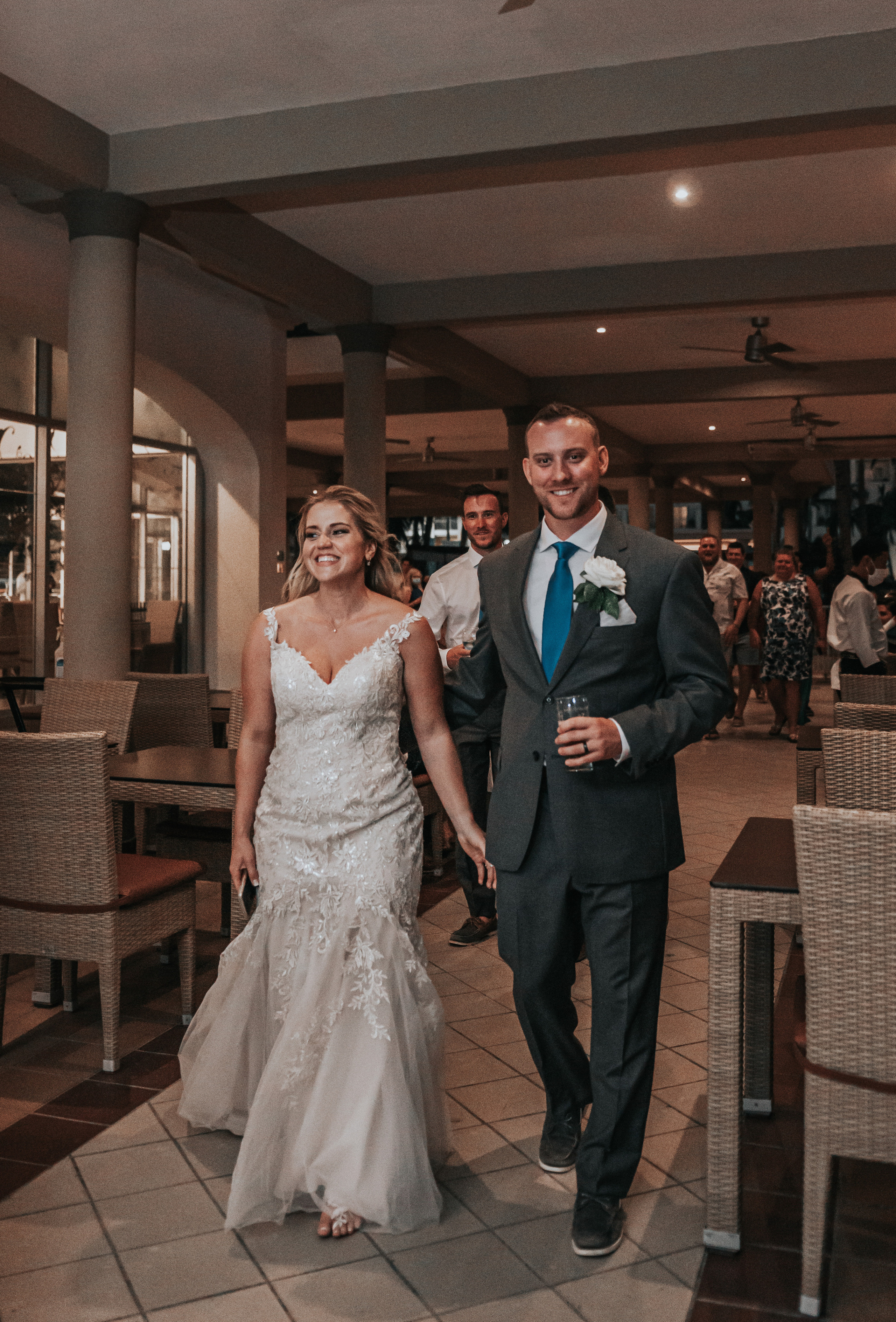 Bride and groom grand entrance at wedding reception in Los Cabos resort
