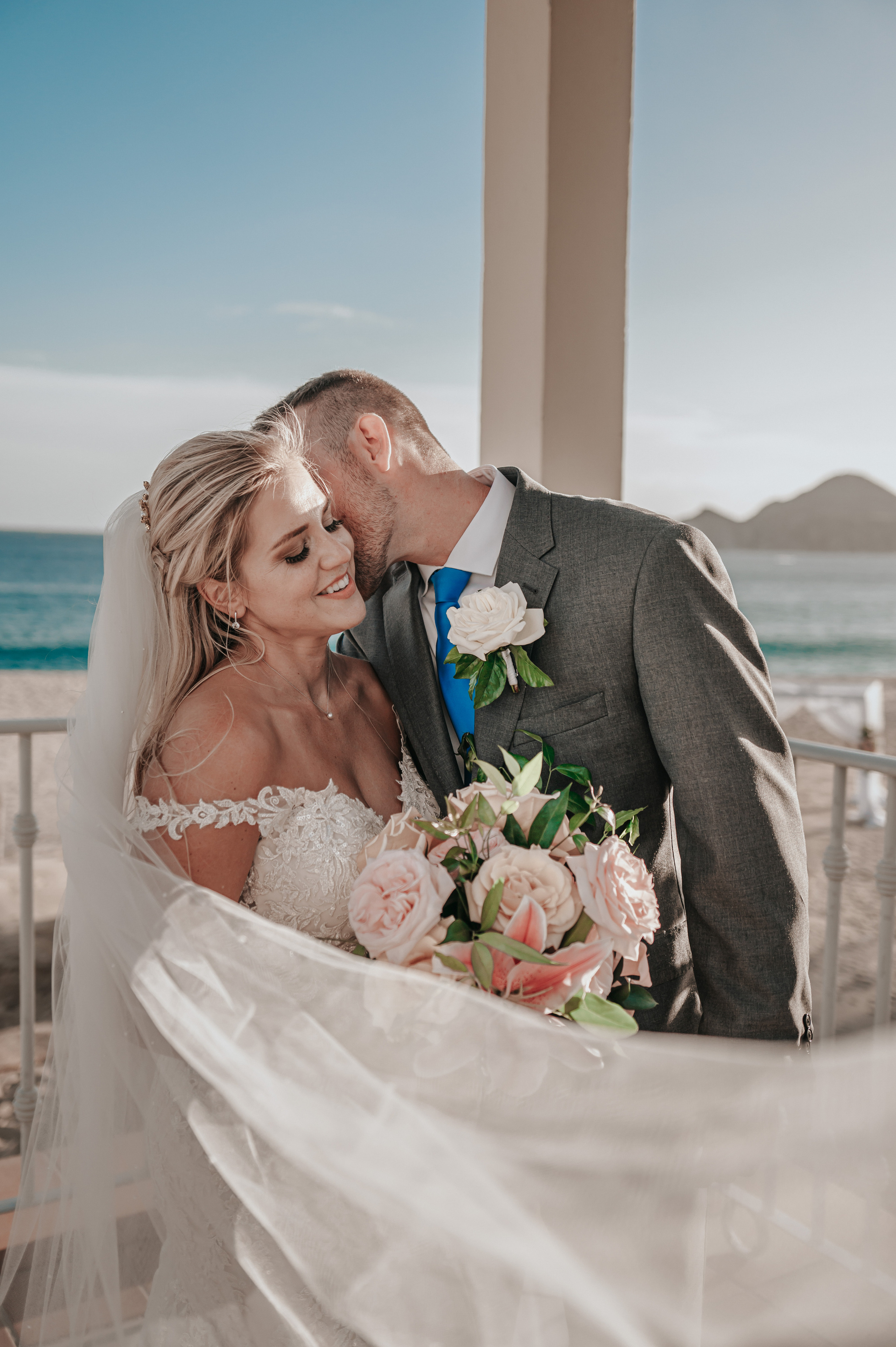 Romantic destination wedding portrait by the ocean in Mexico
