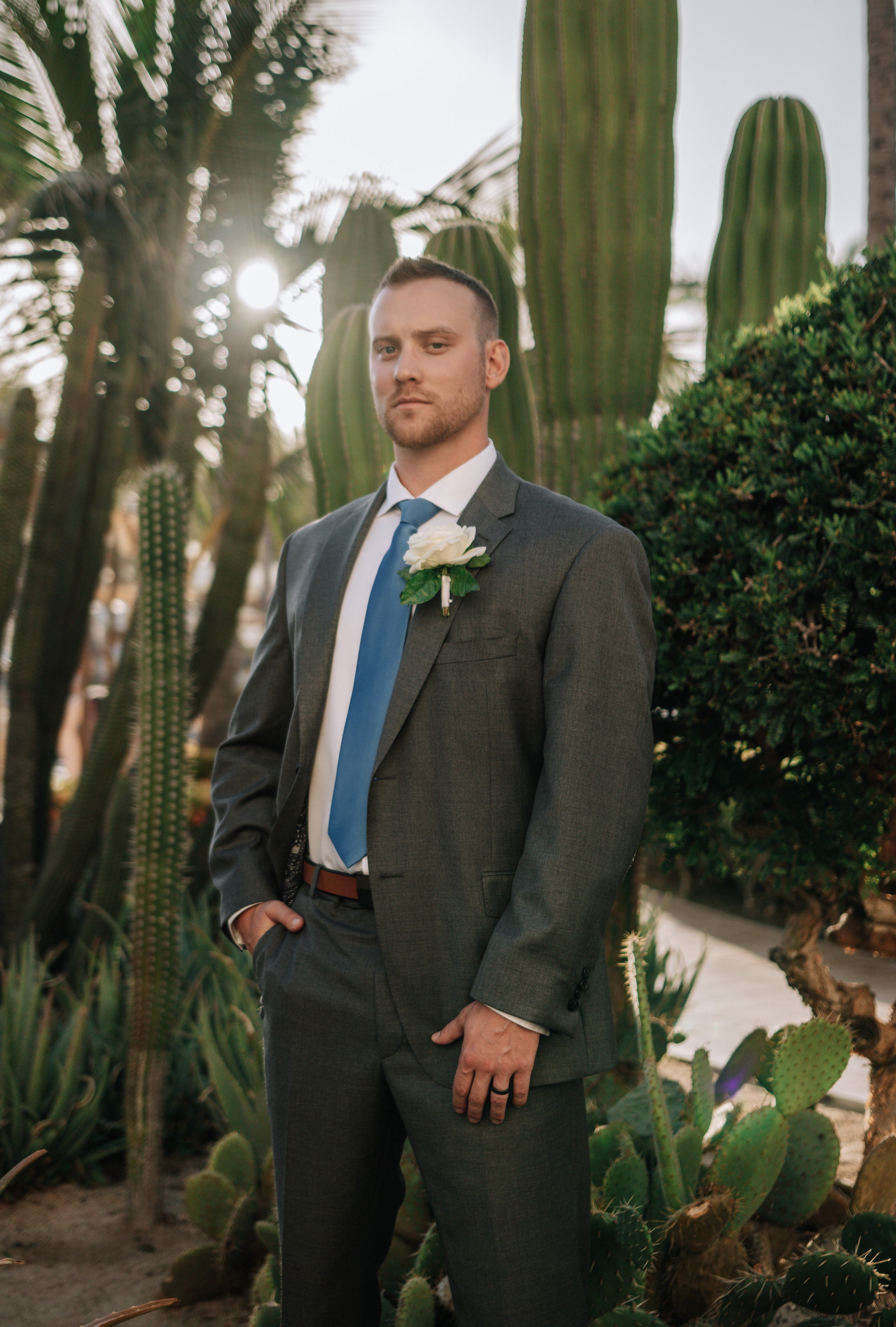 Cabo desert garden groom portrait with tropical and cactus landscape