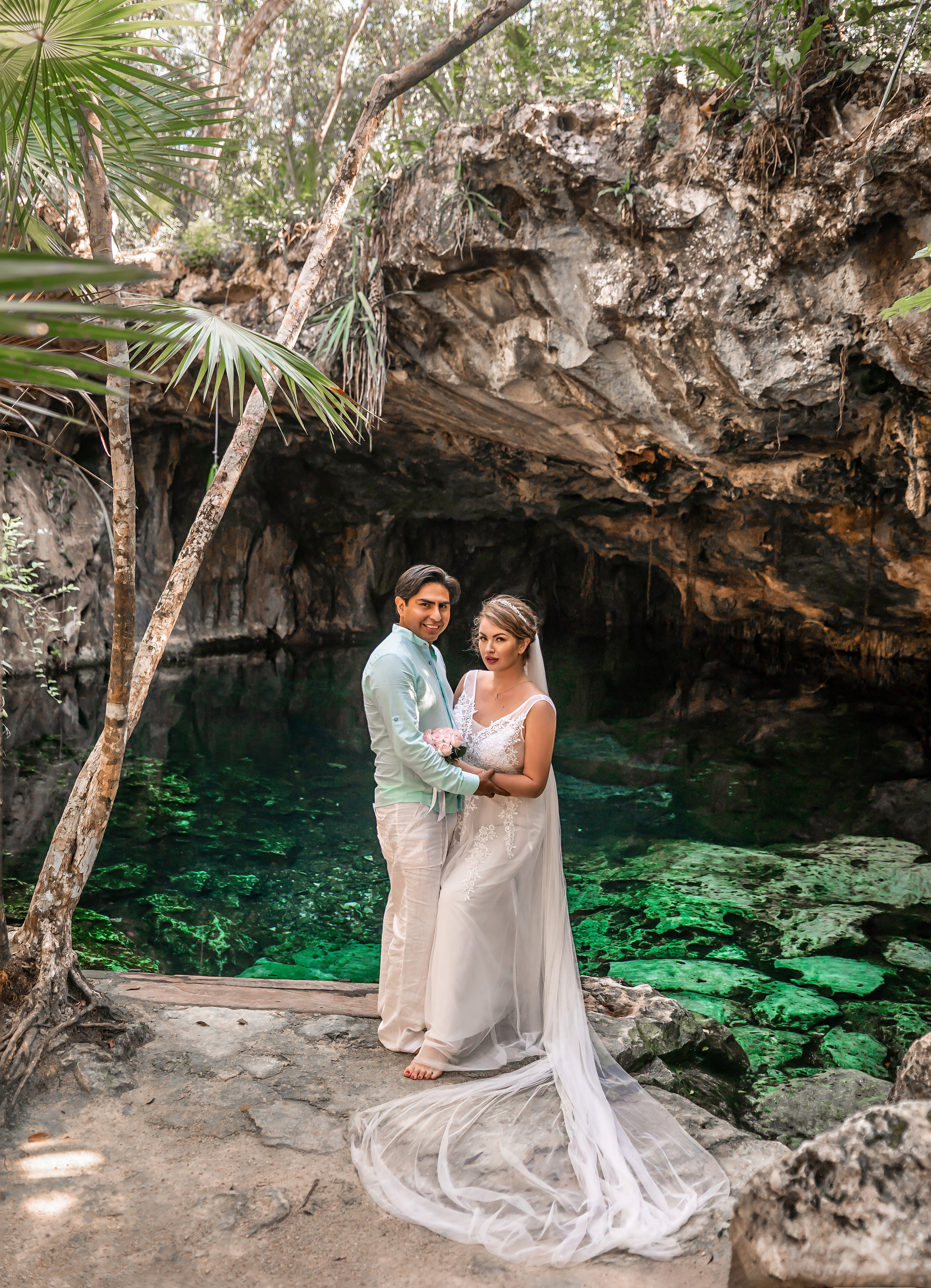 Intimate wedding moment in a cenote near Tulum