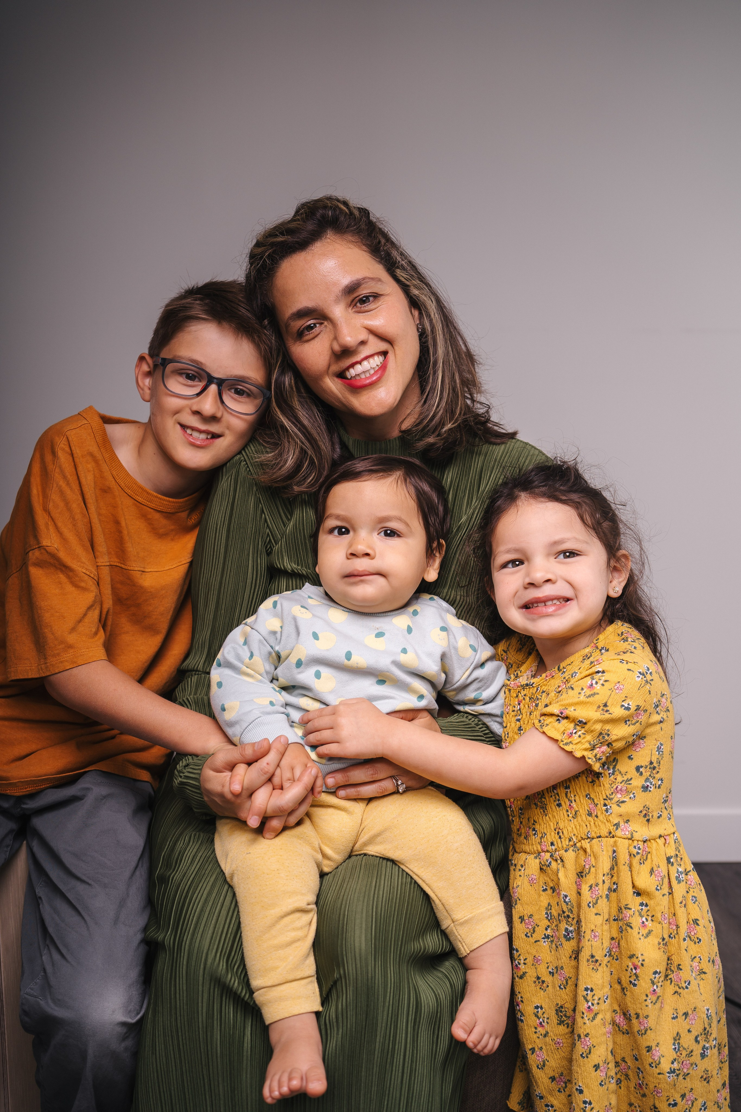 portrait of mother with her kids in studio setting in Burnaby