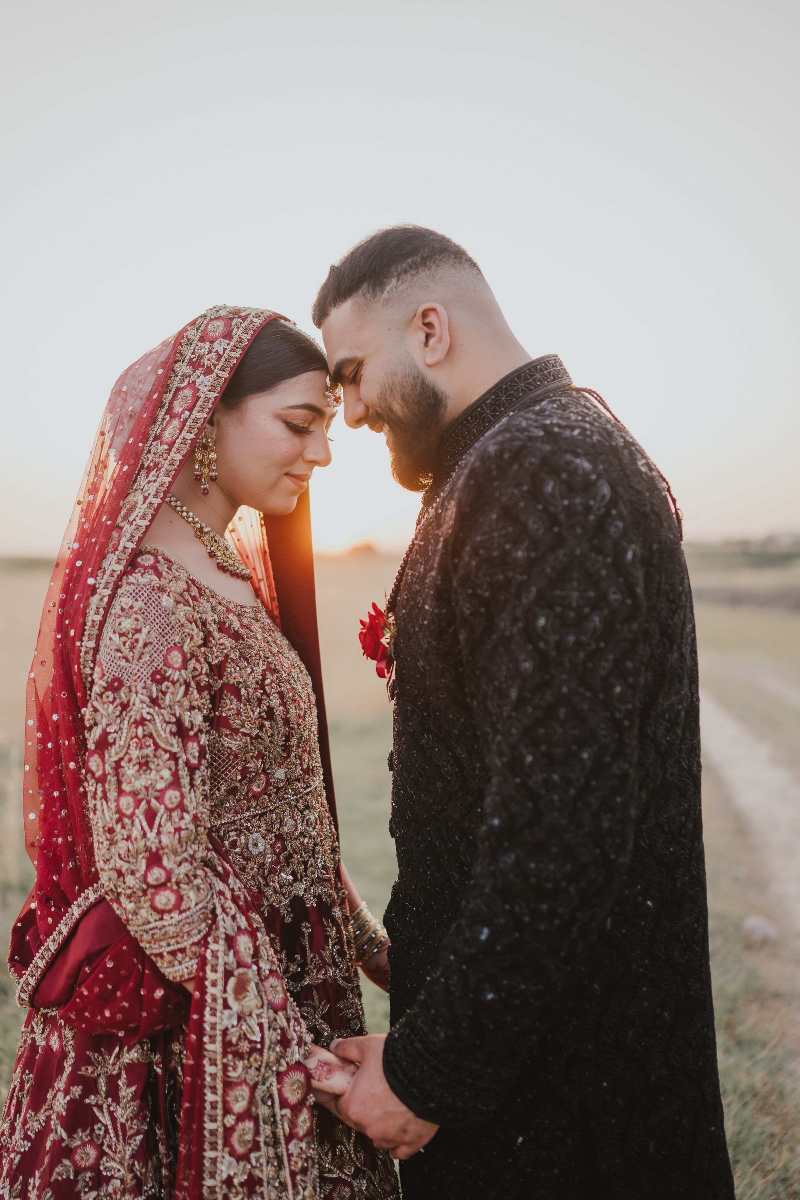 Couple shoot in the fields during sunset 