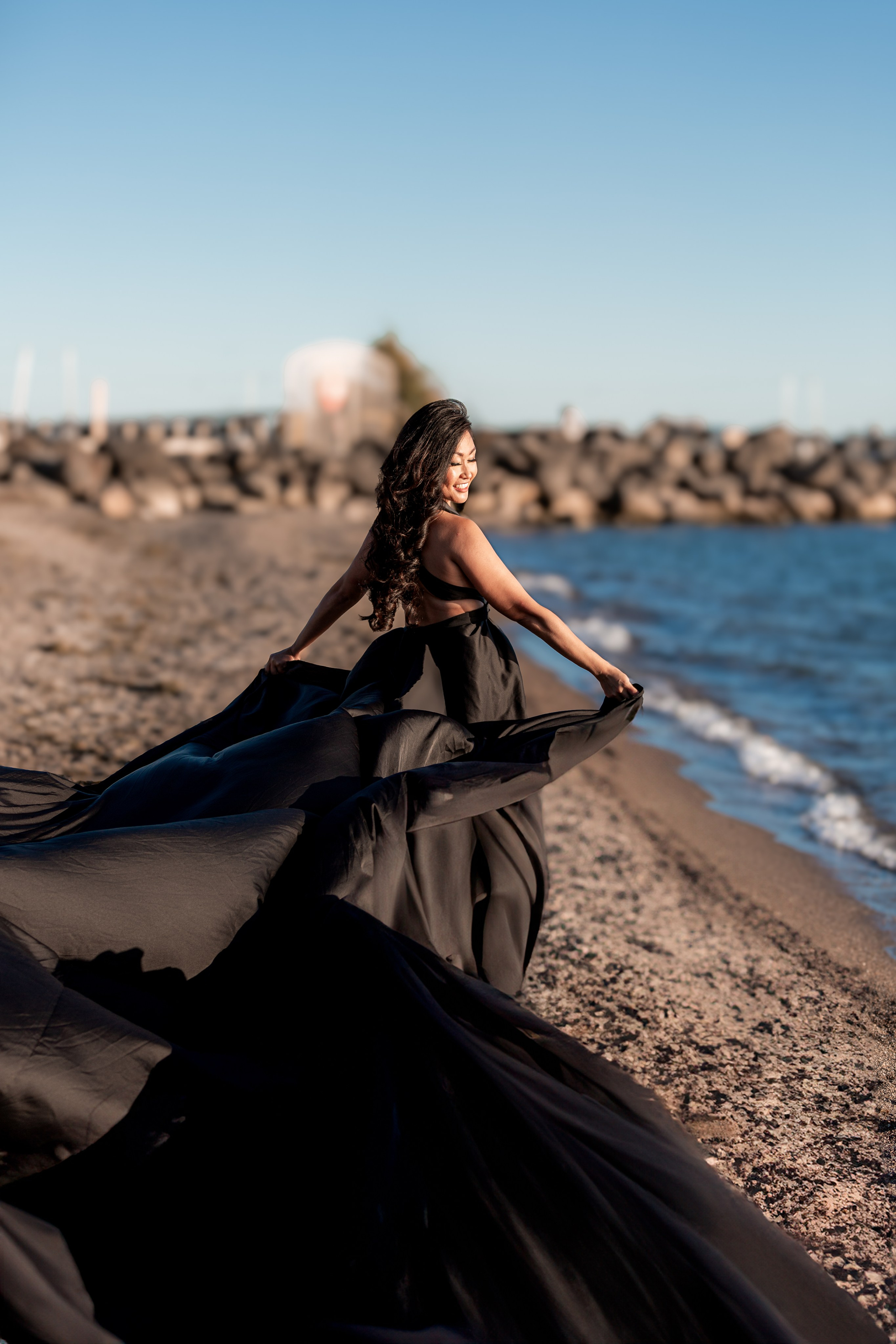 Creative individual portrait photoshoot by the water in Windsor, Ontario, capturing unique style and personality.