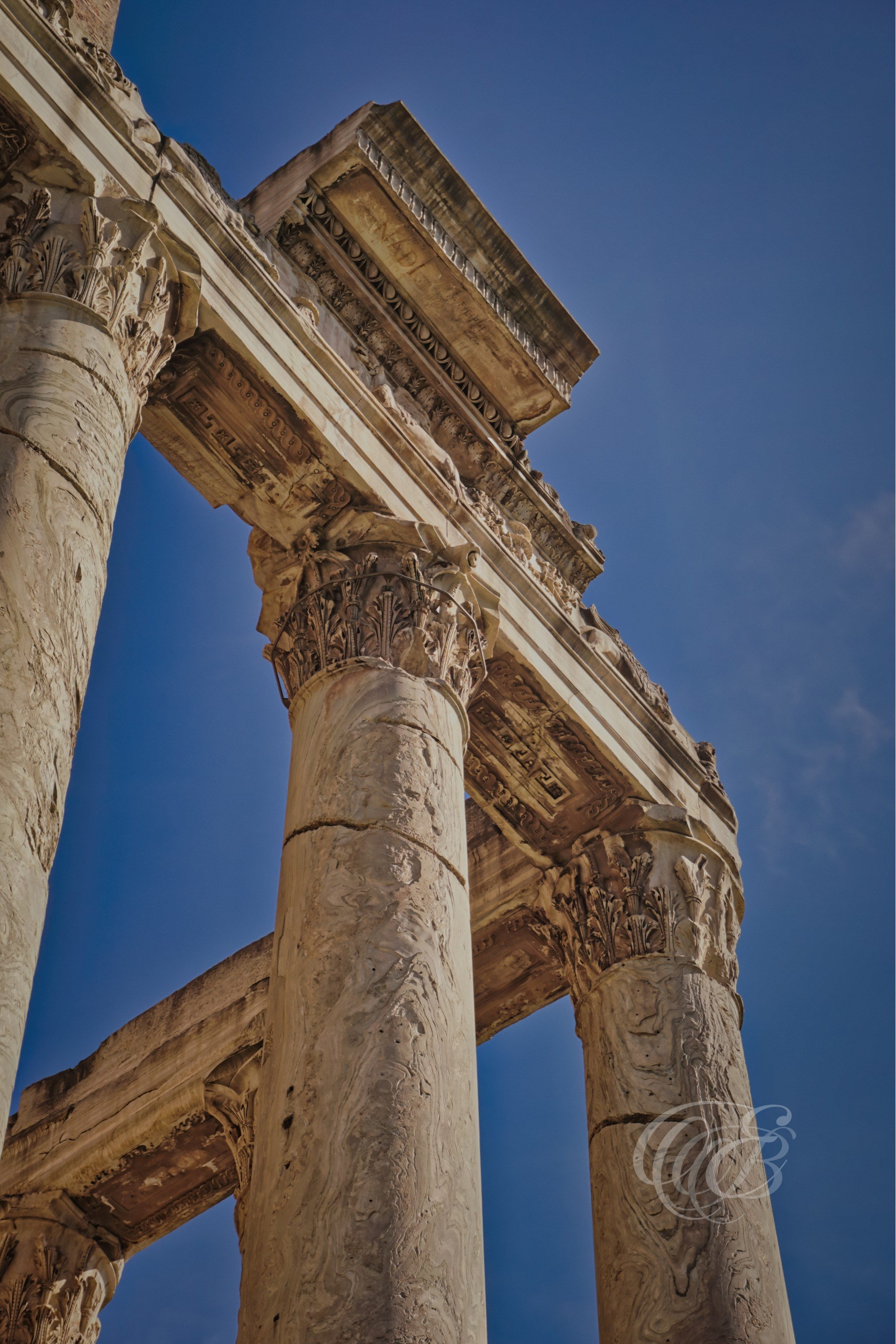 ITALY PHOTOGRAPHY — The Columns of Antoninus and Faustina — The Temple of Antoninus and Faustina in the Roman Forum, distinguished by its towering Corinthian columns and remarkable state of preservation, Rome, Italy — Eduardo Bartoli Photography.