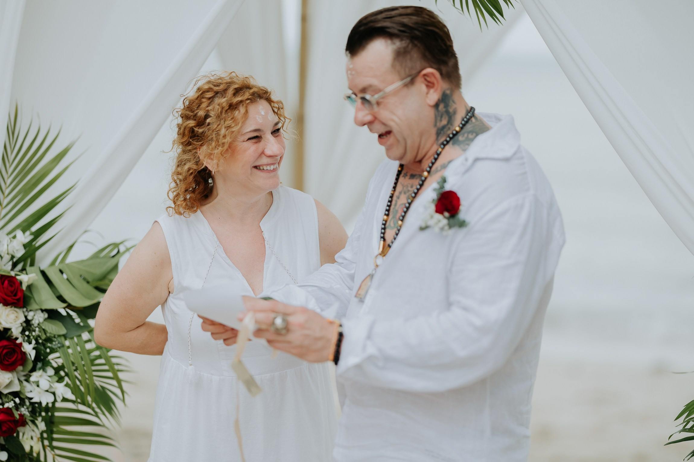 Couple with guests celebrating a spiritual Buddhist wedding ceremony on Koh Samui