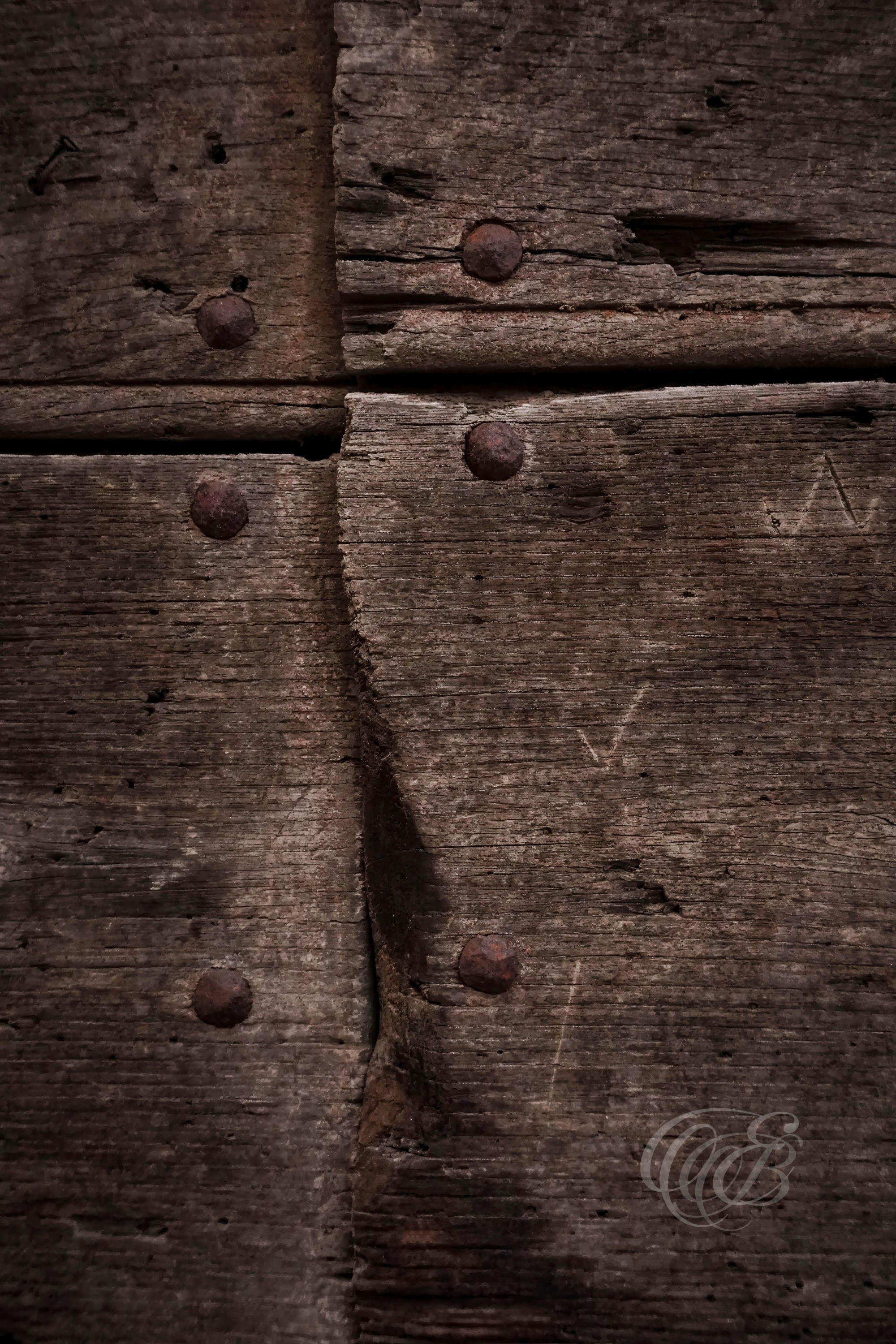 Street Photography — Rome, Italy — Old Door Close-Up — Close-up of aged wood on an old Roman door, revealing weathered grain, natural textures, and the traces of time preserved within the city’s historic architecture — Eduardo Bartoli Photography.