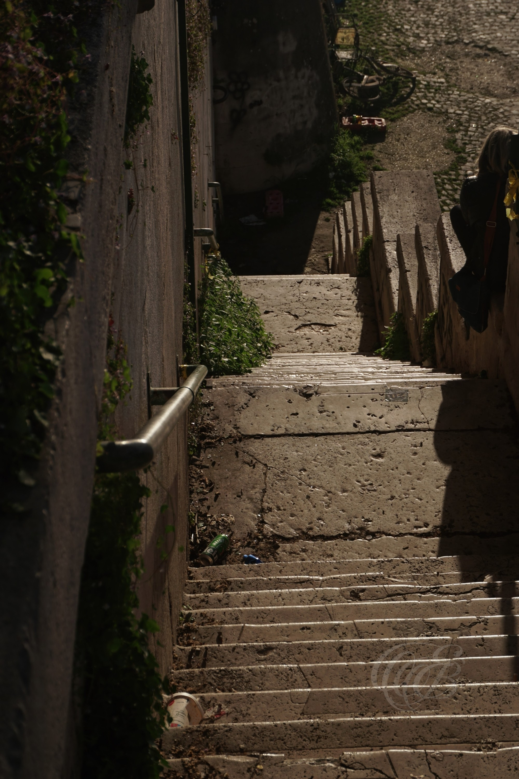 Street Photography — Rome, Italy — Steps by the Tiber — Steps descending toward the Tiber River in Rome, connecting the modern city with its historic riverbanks and the ancient waterway that has shaped Roman life for centuries — Eduardo Bartoli Photography.