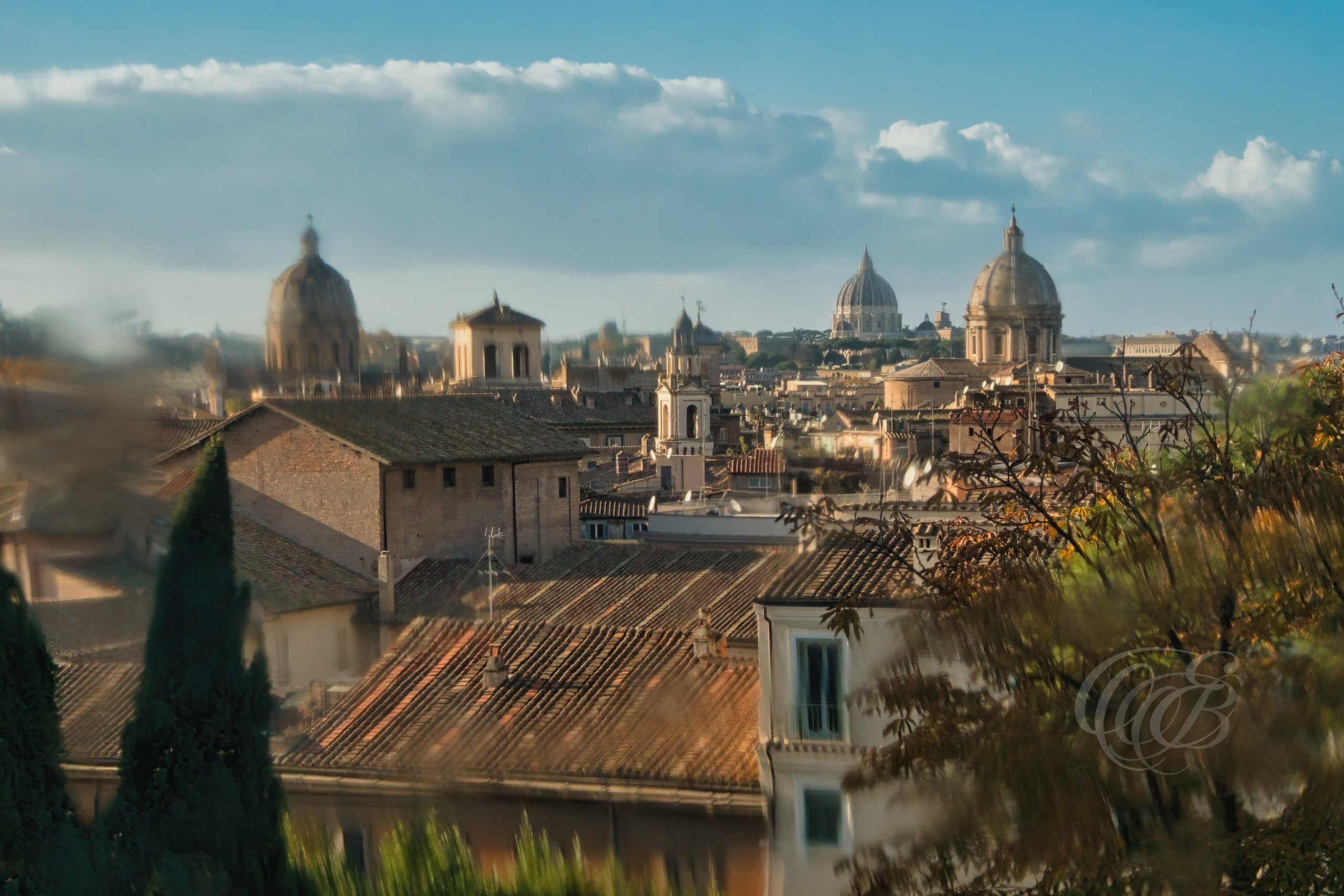 Rome Italy – View through window of historic cityscape – Eduardo Bartoli Fine Art Photography – Photograph capturing Rome’s rooftops and ancient walls framed by a window.
