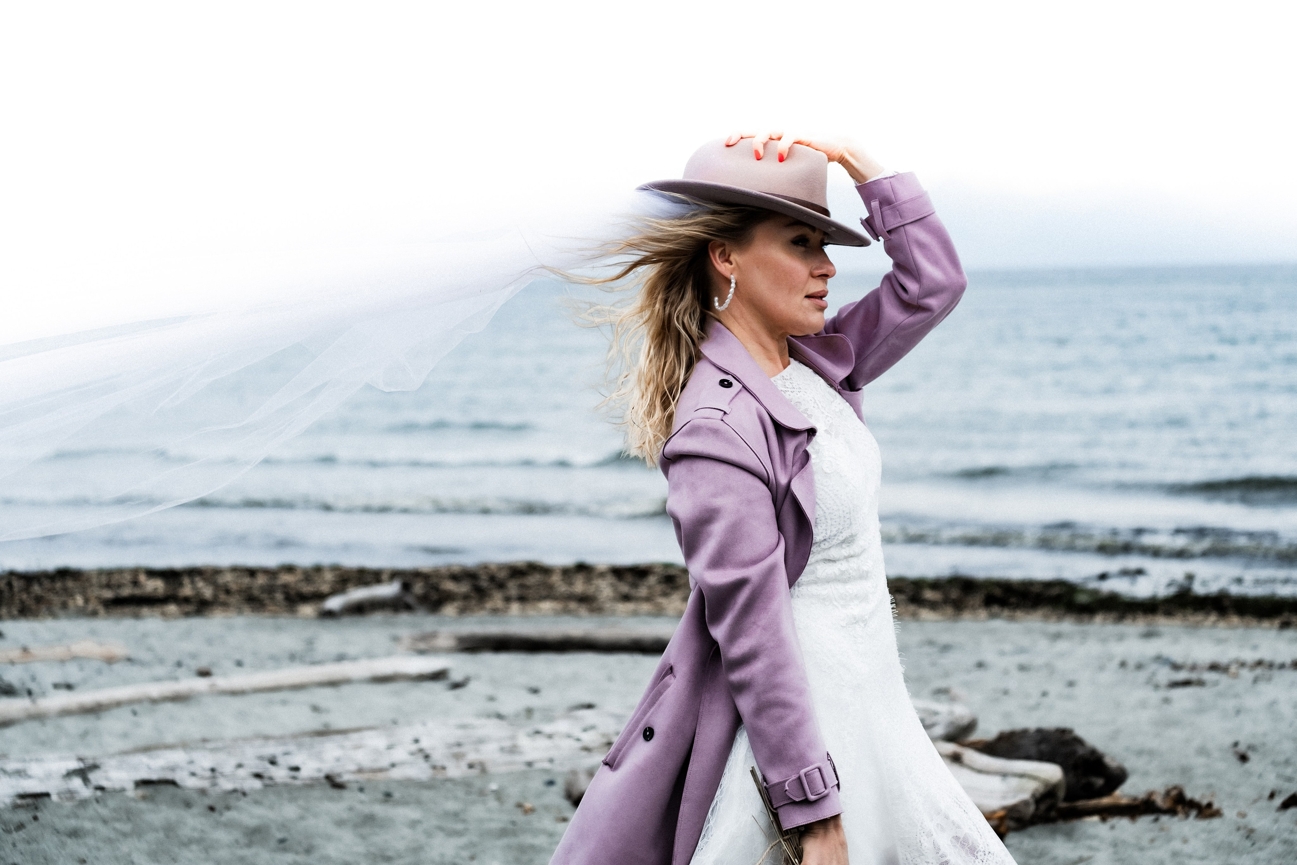 wedding couple portrait with dramatic coastal background