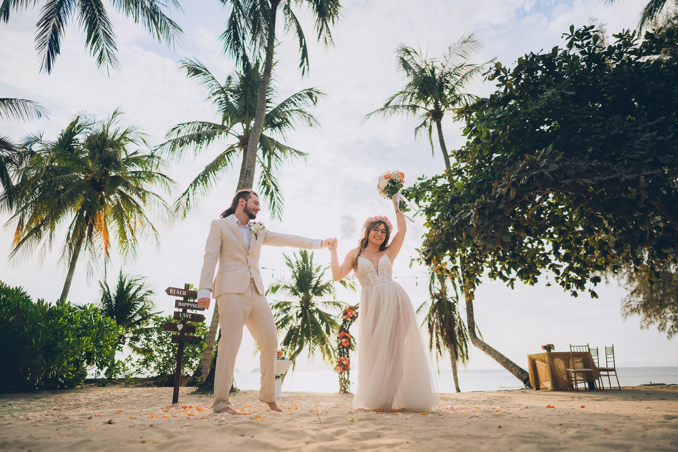 Romantic escape wedding ceremony for two on a secluded beach in Koh Samui, Thailand at sunset