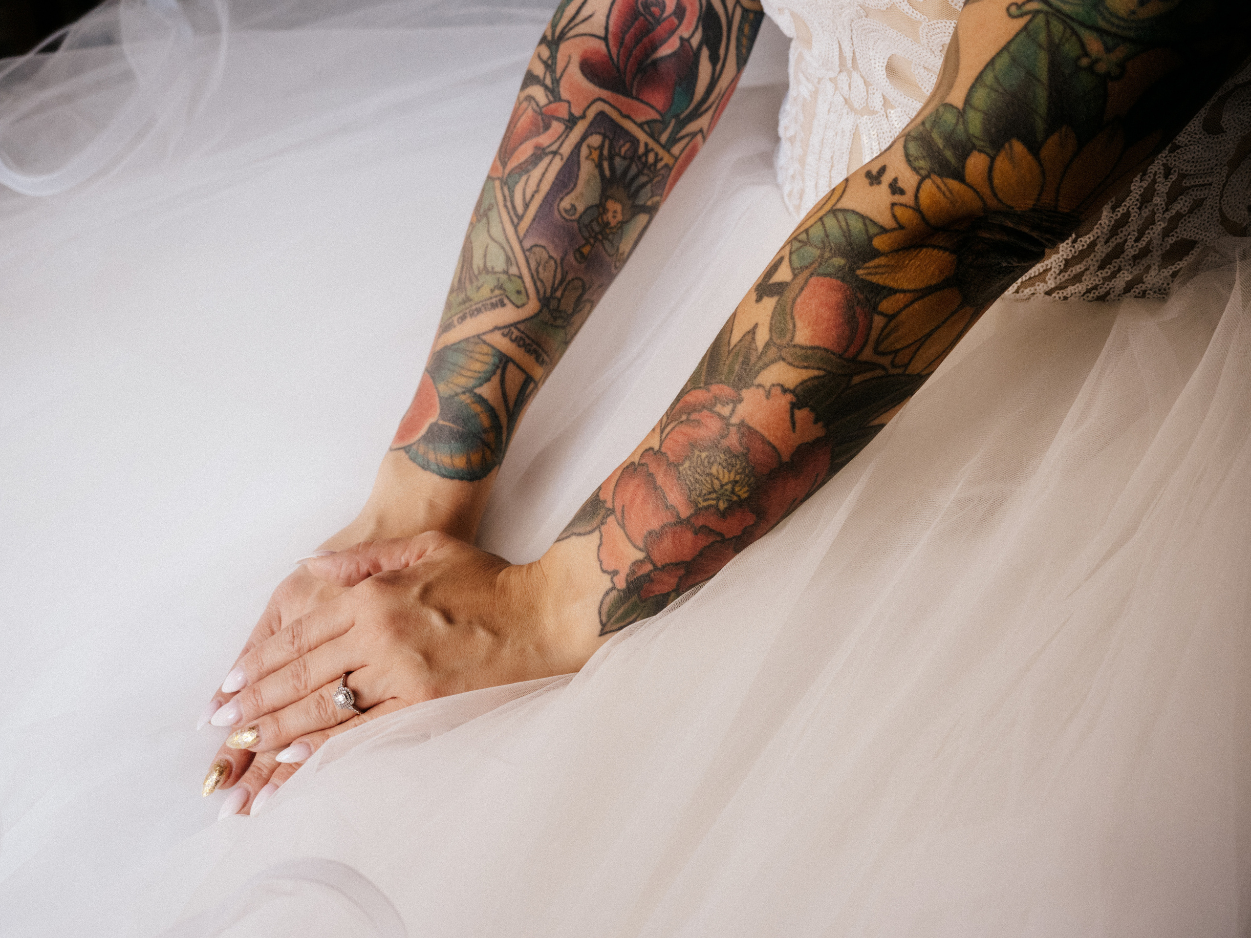 Close up of bride with lots of tattoos.