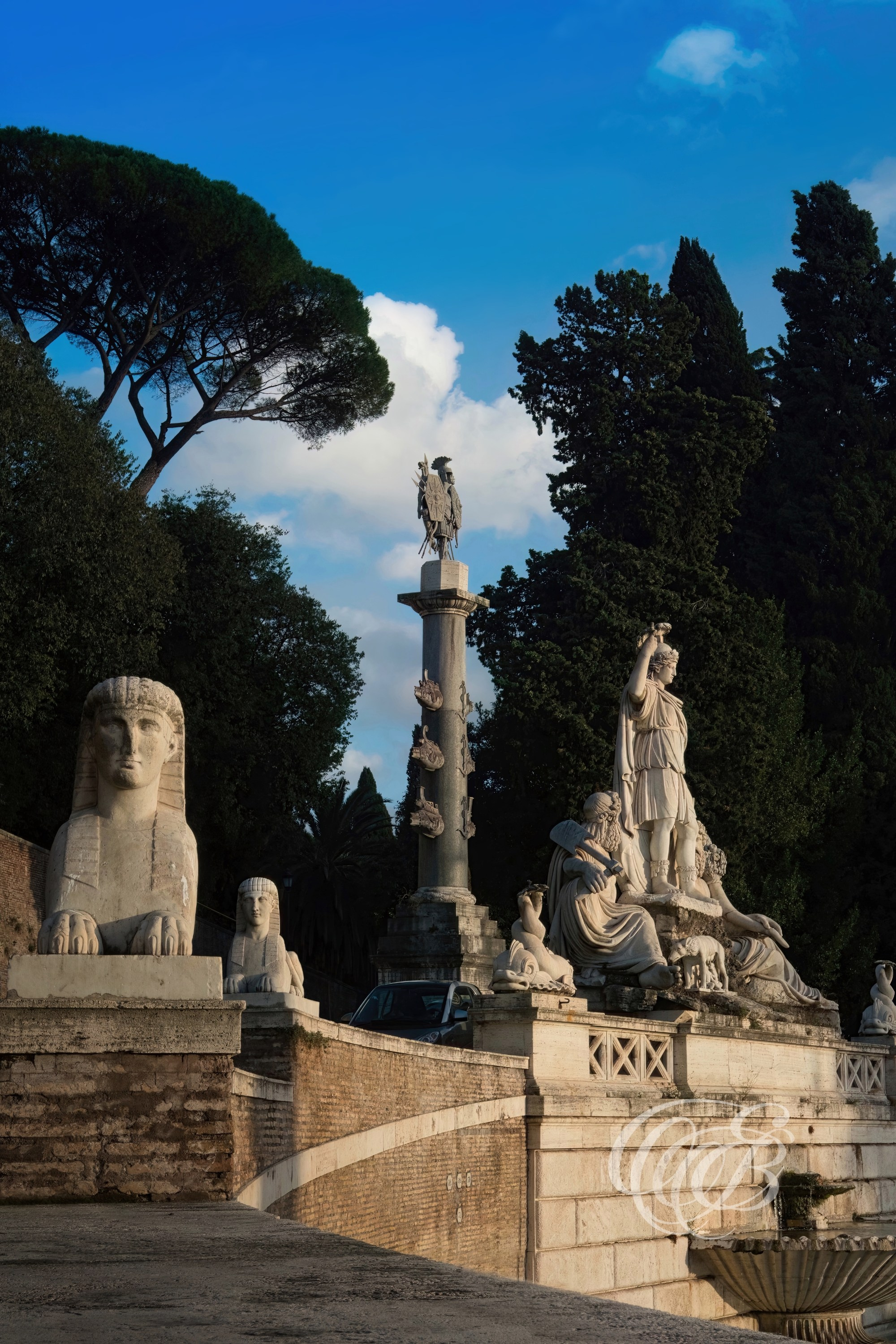 ITALY TRAVEL PHOTOGRAPHY – ITALY – ROME — Roman Goddess Statue and Egyptian-Style Sculpture on Balustrade near Pincian Hill at Piazza del Popolo — Classical statues with Roman and Egyptian-inspired design elements overlooking Piazza del Popolo, Rome, Italy — Eduardo Bartoli Photography.
