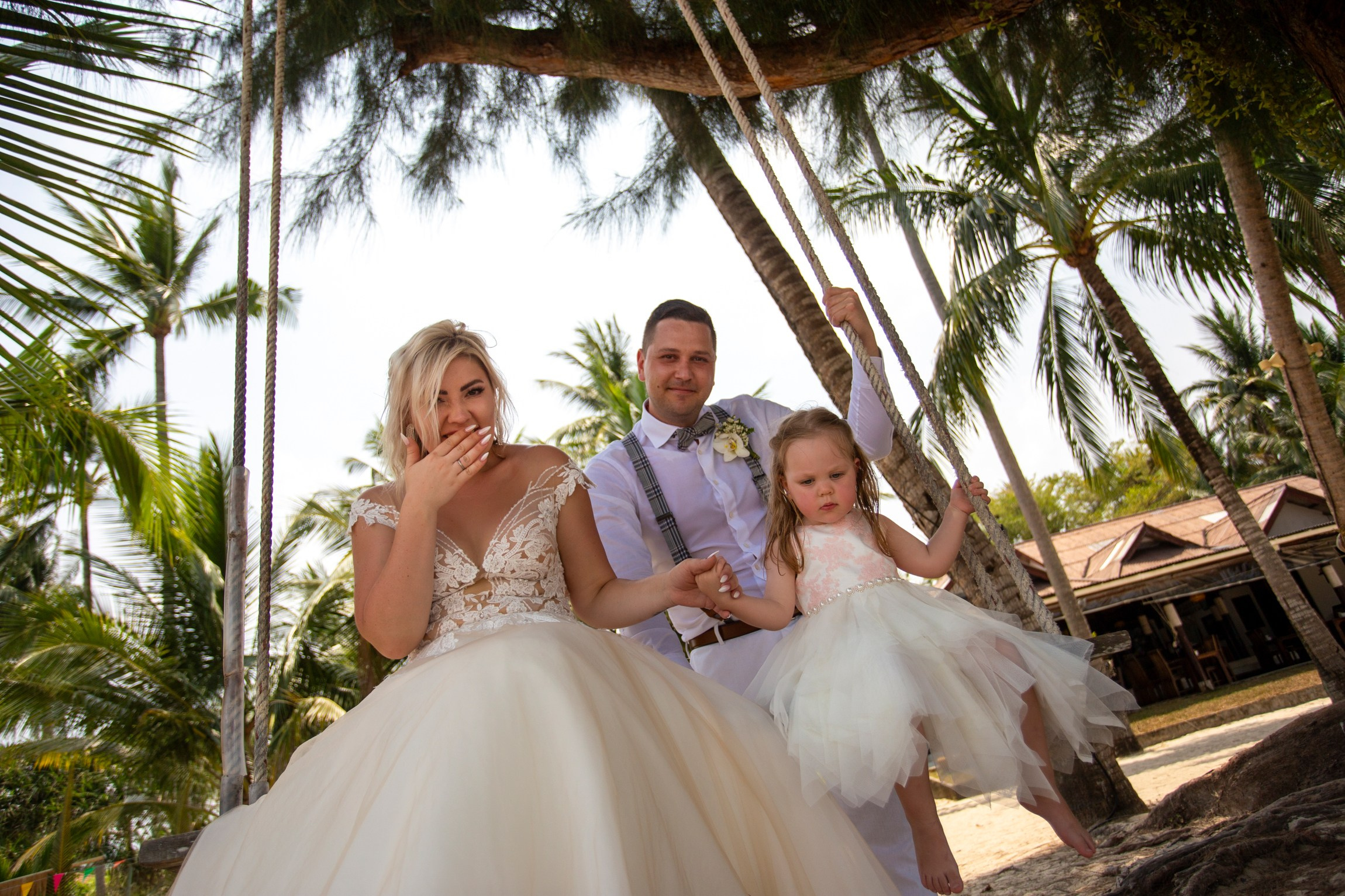 Bride and groom during a romantic beach wedding ceremony on Koh Samui, Thailand, surrounded by tropical scenery and ocean views