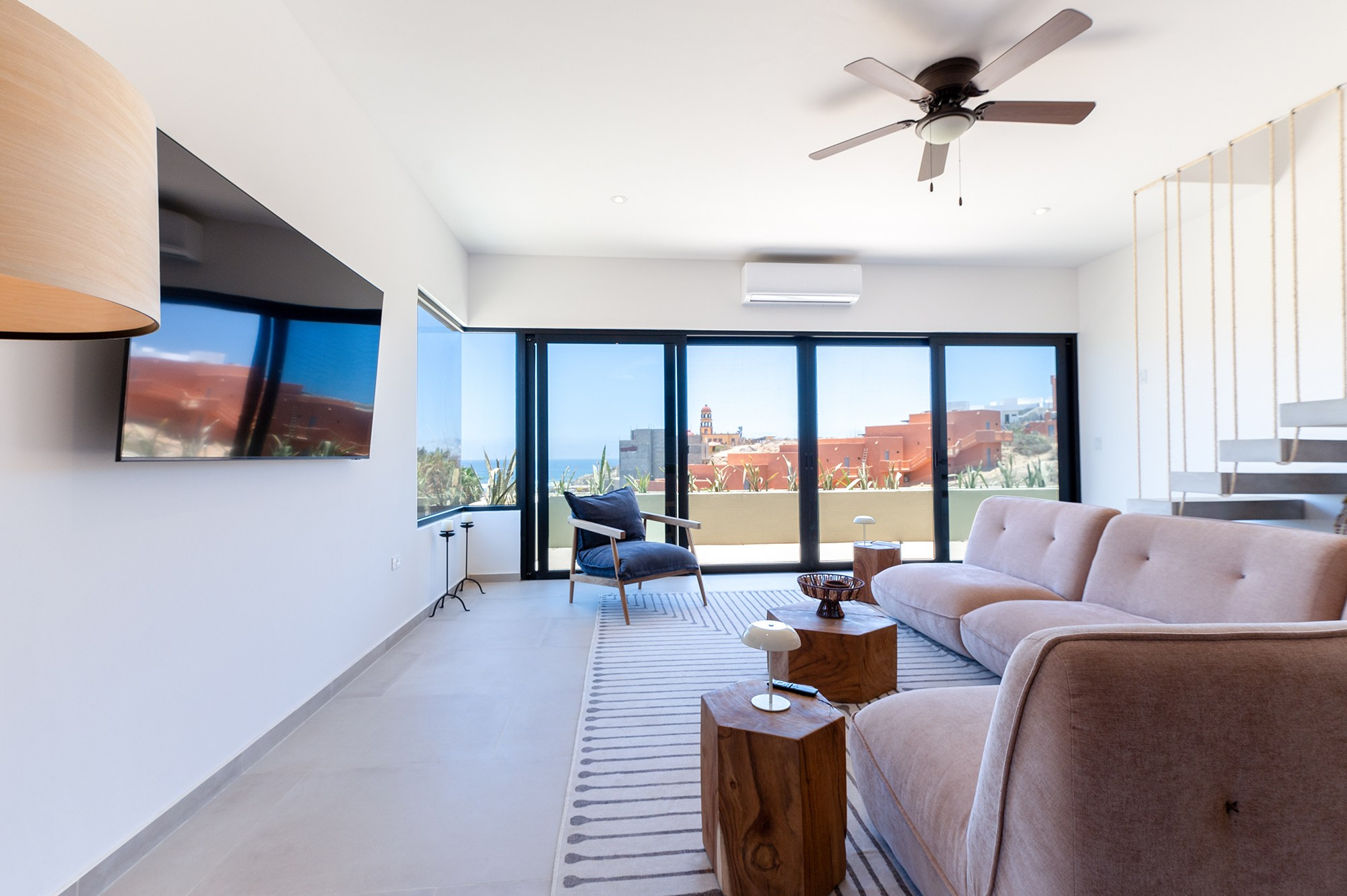 Beachfront living room in Cerritos Baja California Sur – ocean view through large window, luxury real estate photography in BCS