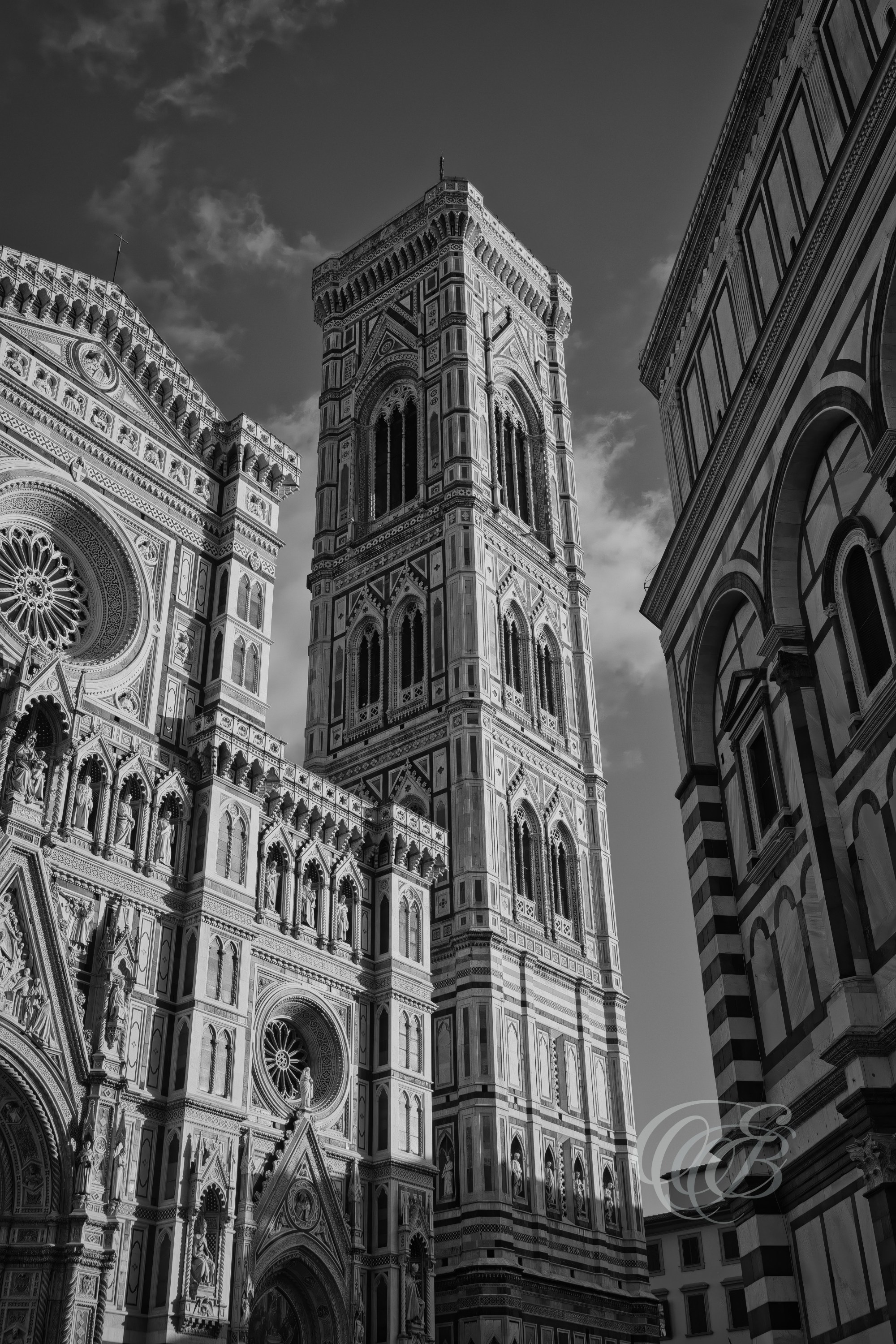 ITALY – FLORENCE — Giotto’s Bell Tower at Sunset Black and White — Gothic bell tower designed by Giotto di Bondone with later contributions by Andrea Pisano and Francesco Talenti, showing detailed marble façade and vertical architectural structure beside Florence Cathedral, Florence, Italy — Eduardo Bartoli Photography.